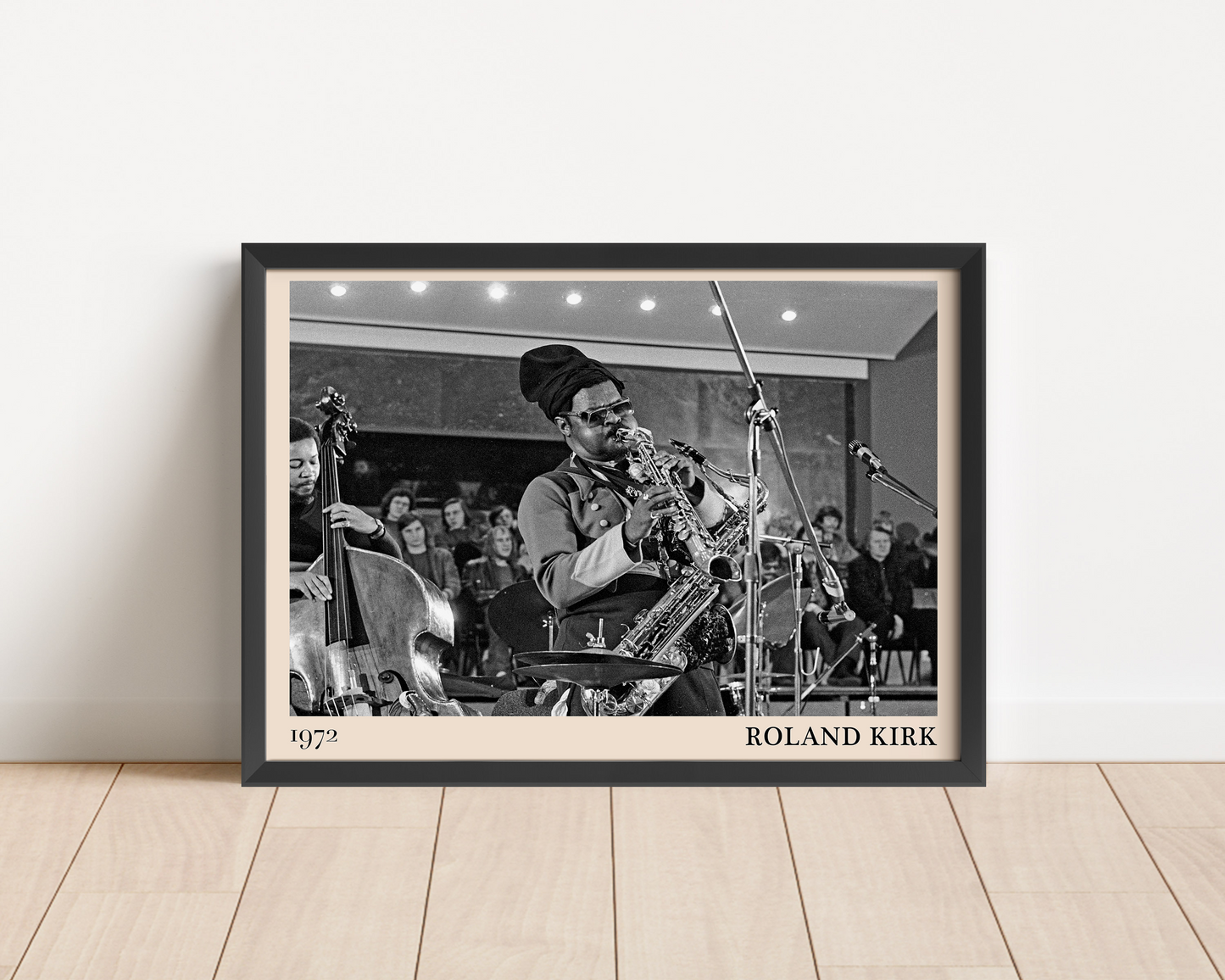 2024 photo of Emmet Cohen crafted into a black framed-poster, leaning against a white wall