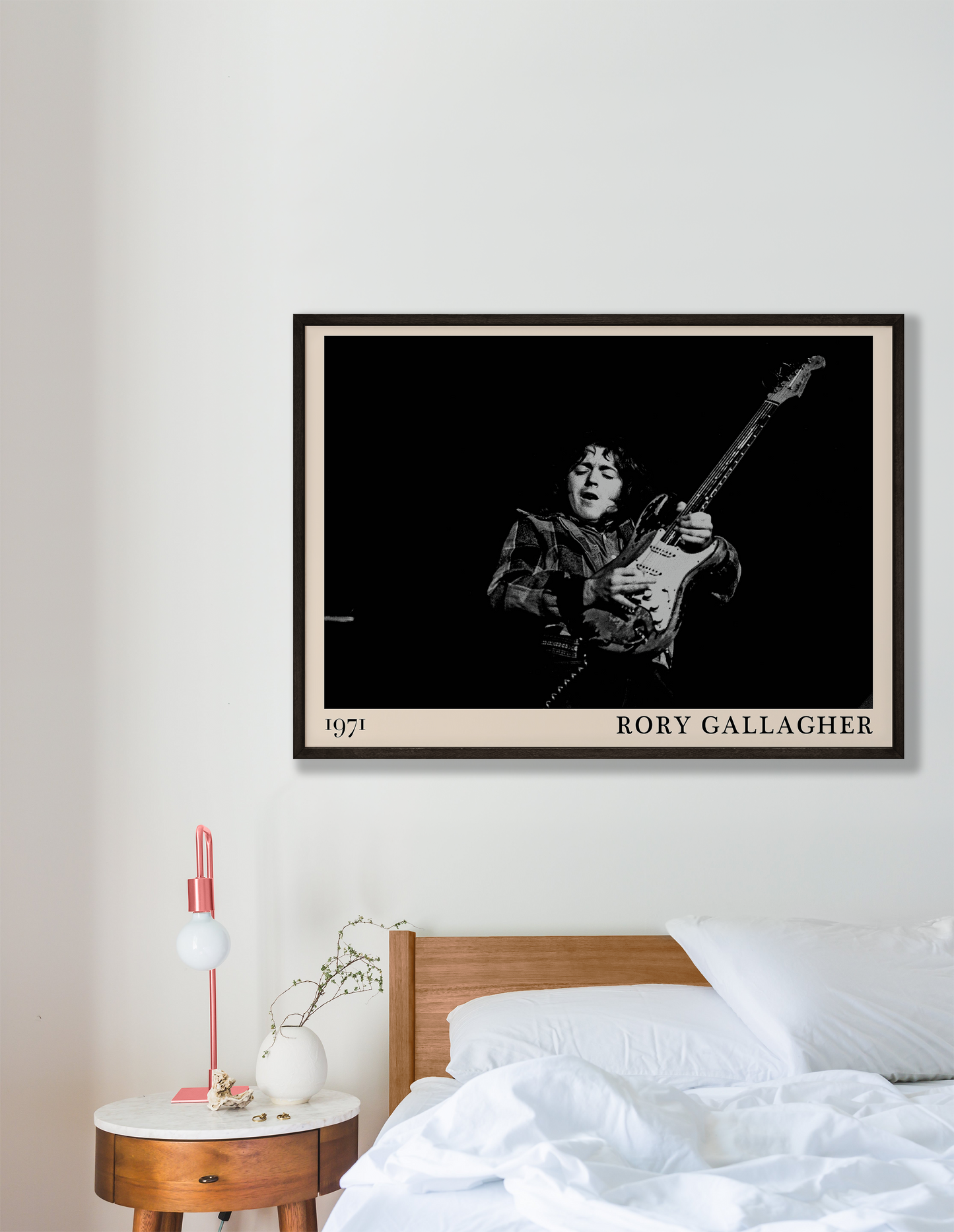 Iconic image of rock musician Rory Gallagher performing, captured by Heinrich Klaffs in 1971 and transformed into vintage-inspired wall decor hanging on a white bedroom wall