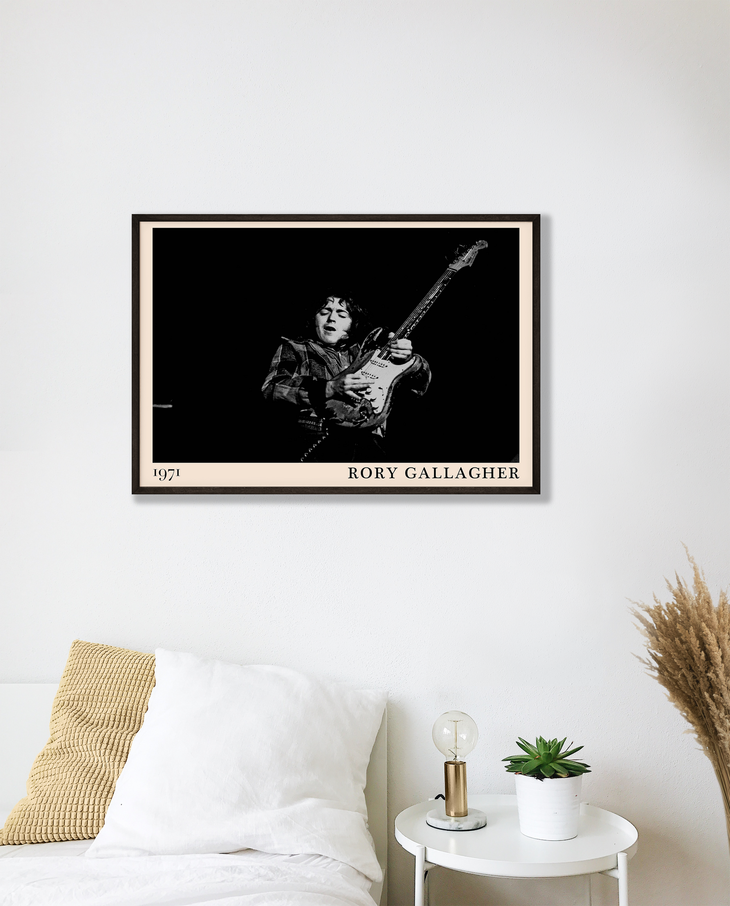 Iconic image of rock musician Rory Gallagher performing, captured by Heinrich Klaffs in 1971 and transformed into vintage-inspired wall decor hanging on a white bedroom wall