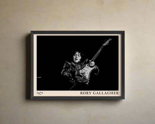 Iconic image of rock band The Who performing, captured by Heinrich Klaffs and transformed into vintage-inspired wall decor, hanging on a light brown rustic concrete wall