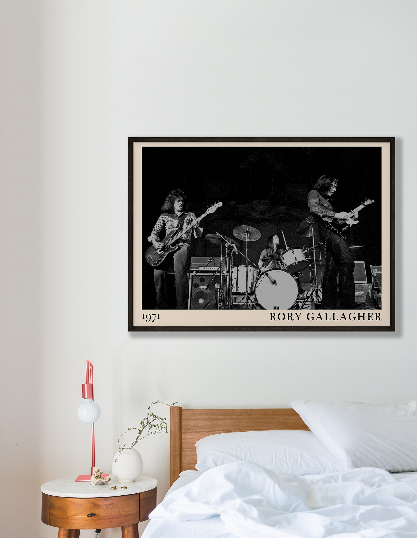Iconic image of rock band Rory Gallagher performing, captured by Heinrich Klaffs in 1971 and transformed into vintage-inspired wall decor hanging on a white bedroom wall