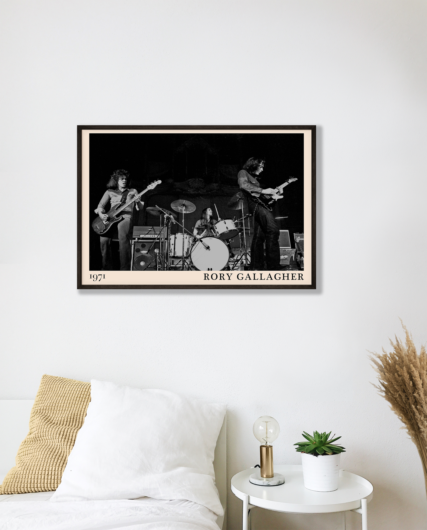 Iconic image of rock band Rory Gallagher performing, captured by Heinrich Klaffs in 1971 and transformed into vintage-inspired wall decor hanging on a white bedroom wall