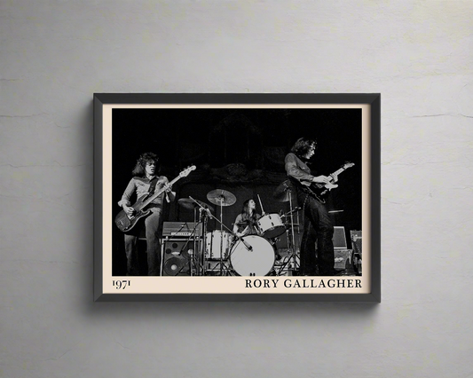 Iconic image of rock band Rory Gallagher performing, captured by Heinrich Klaffs and transformed into vintage-inspired wall decor, hanging on a white rustic concrete wall