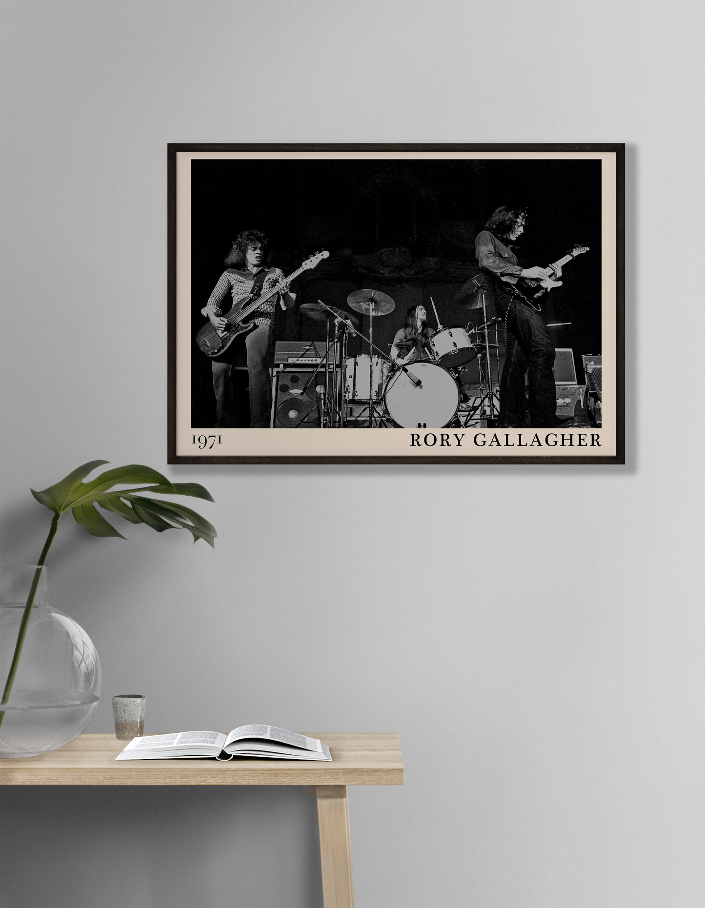 Iconic image of rock band Rory Gallagher performing, captured by Heinrich Klaffs in 1971 and transformed into vintage-inspired wall decor hanging on a white living room wall
