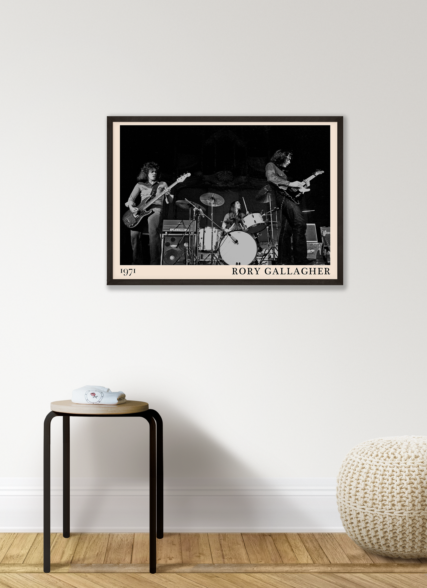 Iconic image of rock band Rory Gallagher performing, captured by Heinrich Klaffs in 1971 and transformed into vintage-inspired wall decor hanging on a white living room wall
