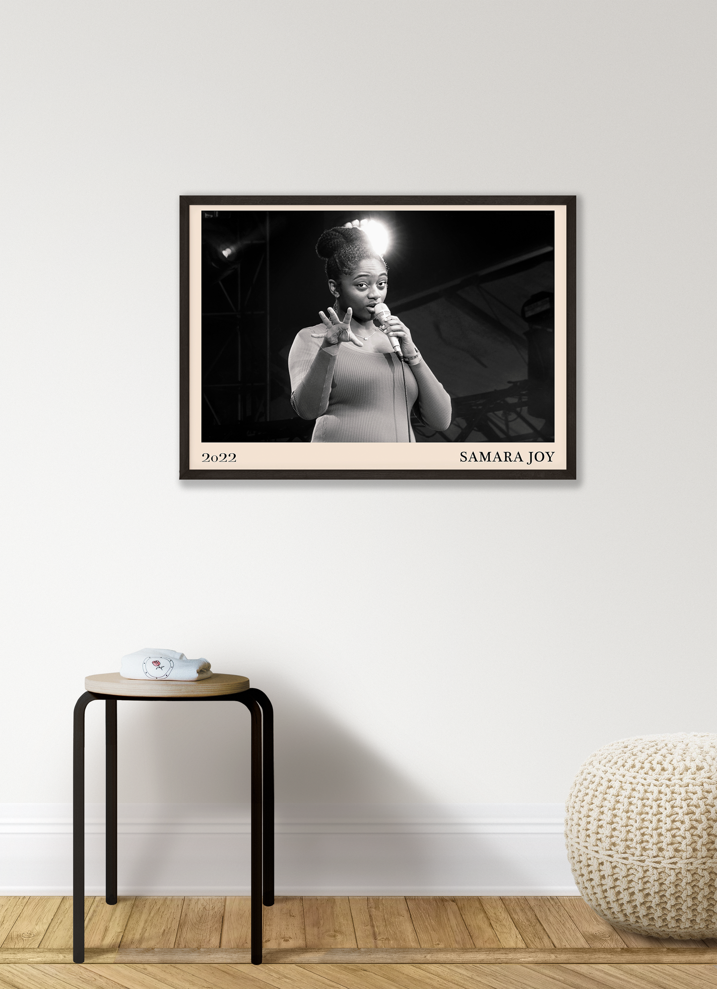 2022 photo of Samara Joy crafted into a black framed-poster, hanging on a white living room wall