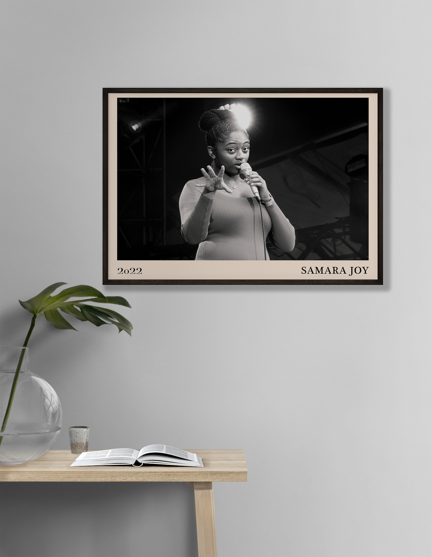 2022 photo of Samara Joy crafted into a black framed-poster, hanging on a white living room wall