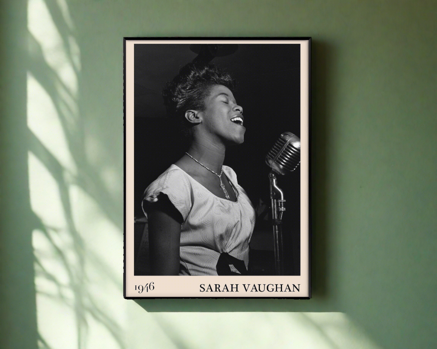 1946 photograph of Sarah Vaughan crafted into a black framed poster. The poster is hanging on a green wall.