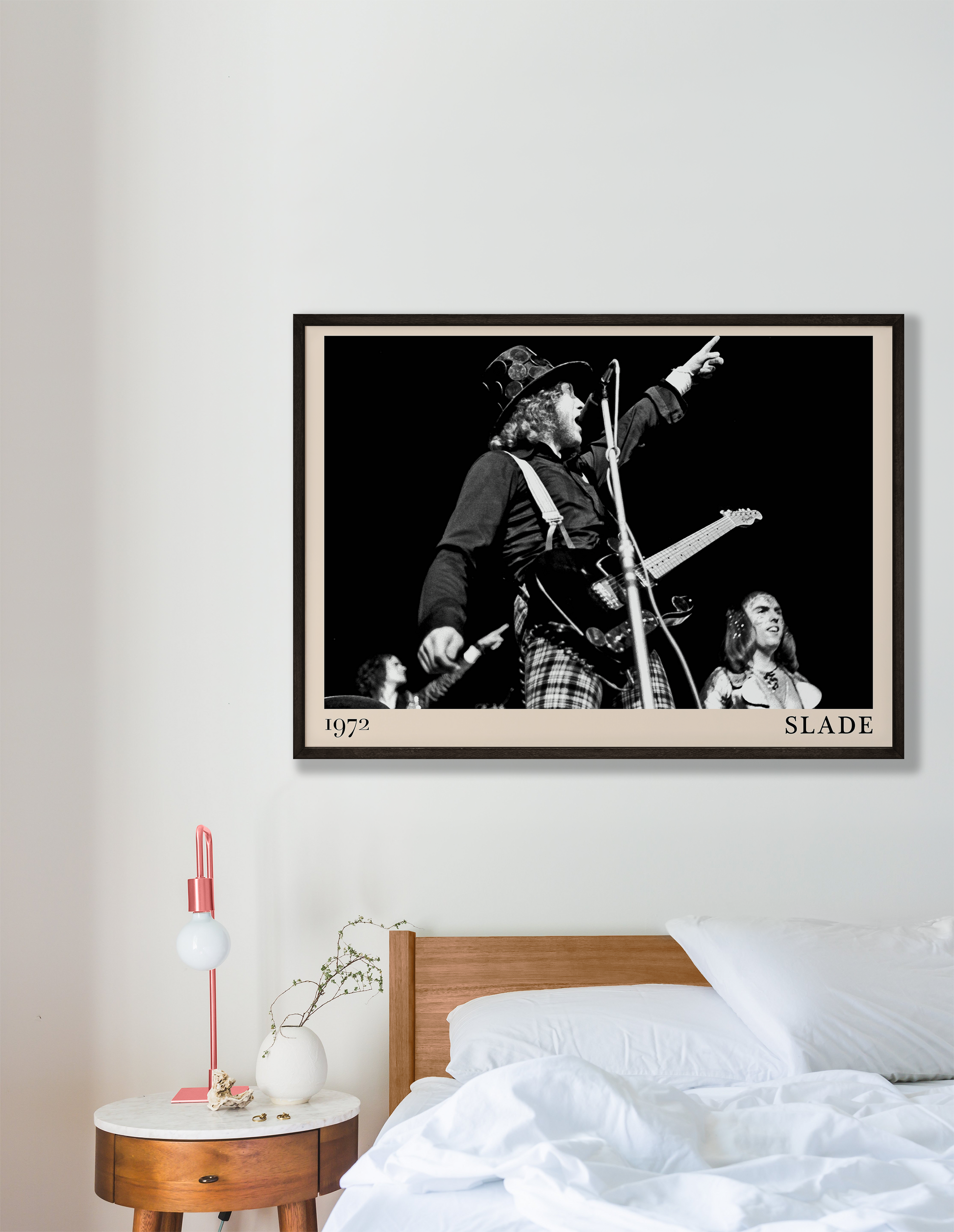 Iconic image of rock band Slade performing, captured by Heinrich Klaffs in 1971 and transformed into vintage-inspired wall decor hanging on a white bedroom wall