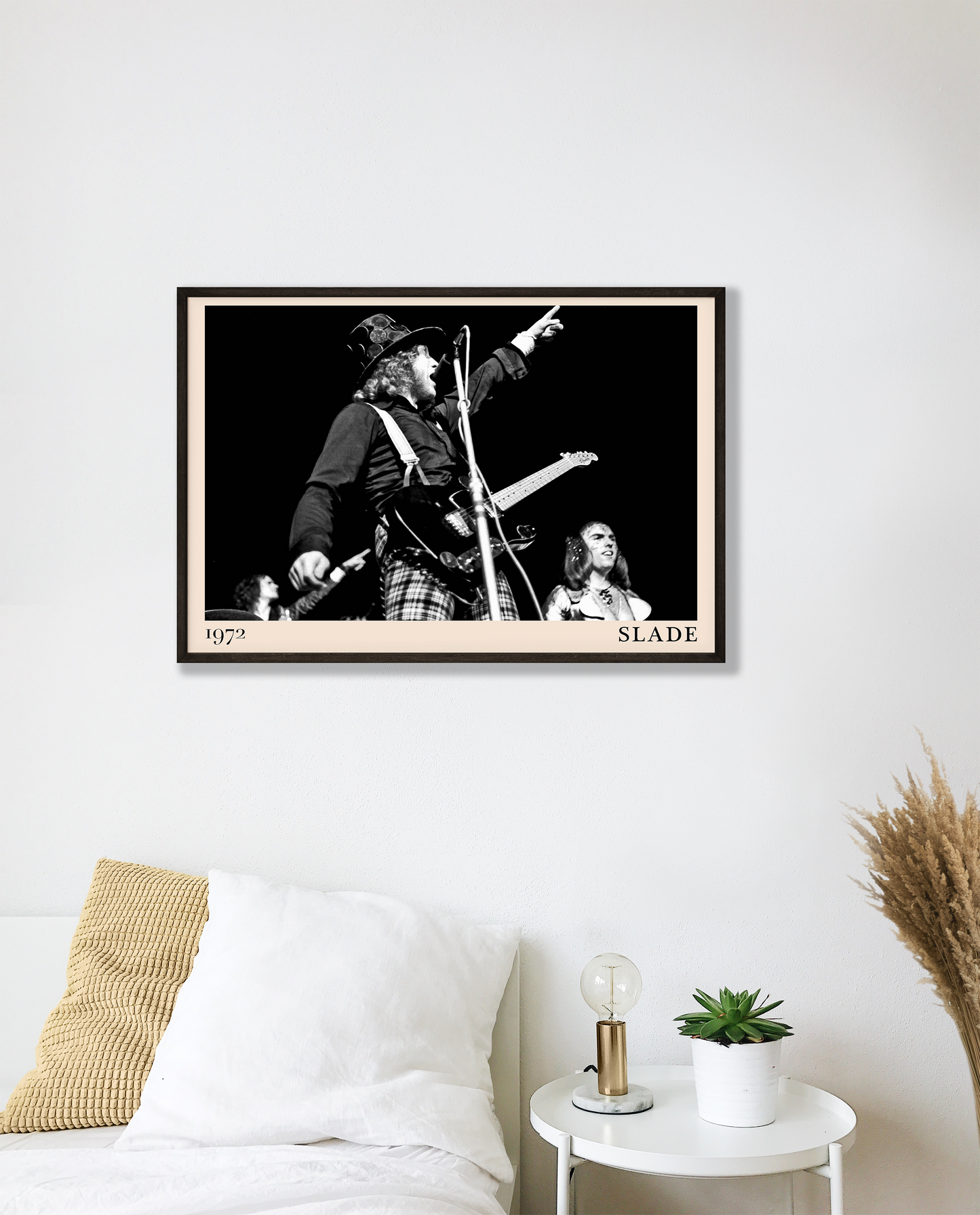 Iconic image of rock band Slade performing, captured by Heinrich Klaffs in 1971 and transformed into vintage-inspired wall decor hanging on a white bedroom wall