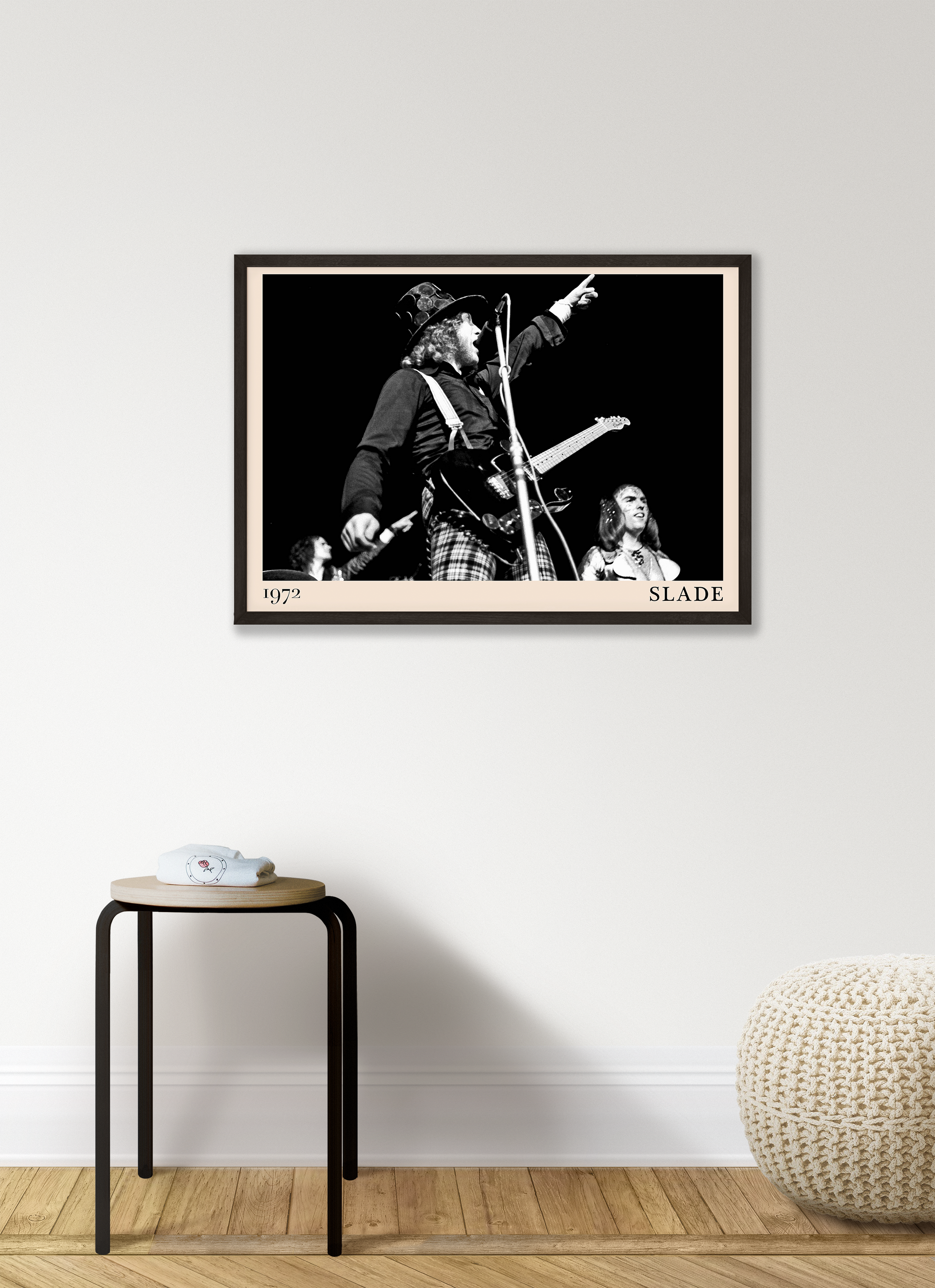 Iconic image of rock band Slade performing, captured by Heinrich Klaffs in 1971 and transformed into vintage-inspired wall decor hanging on a white living room wall