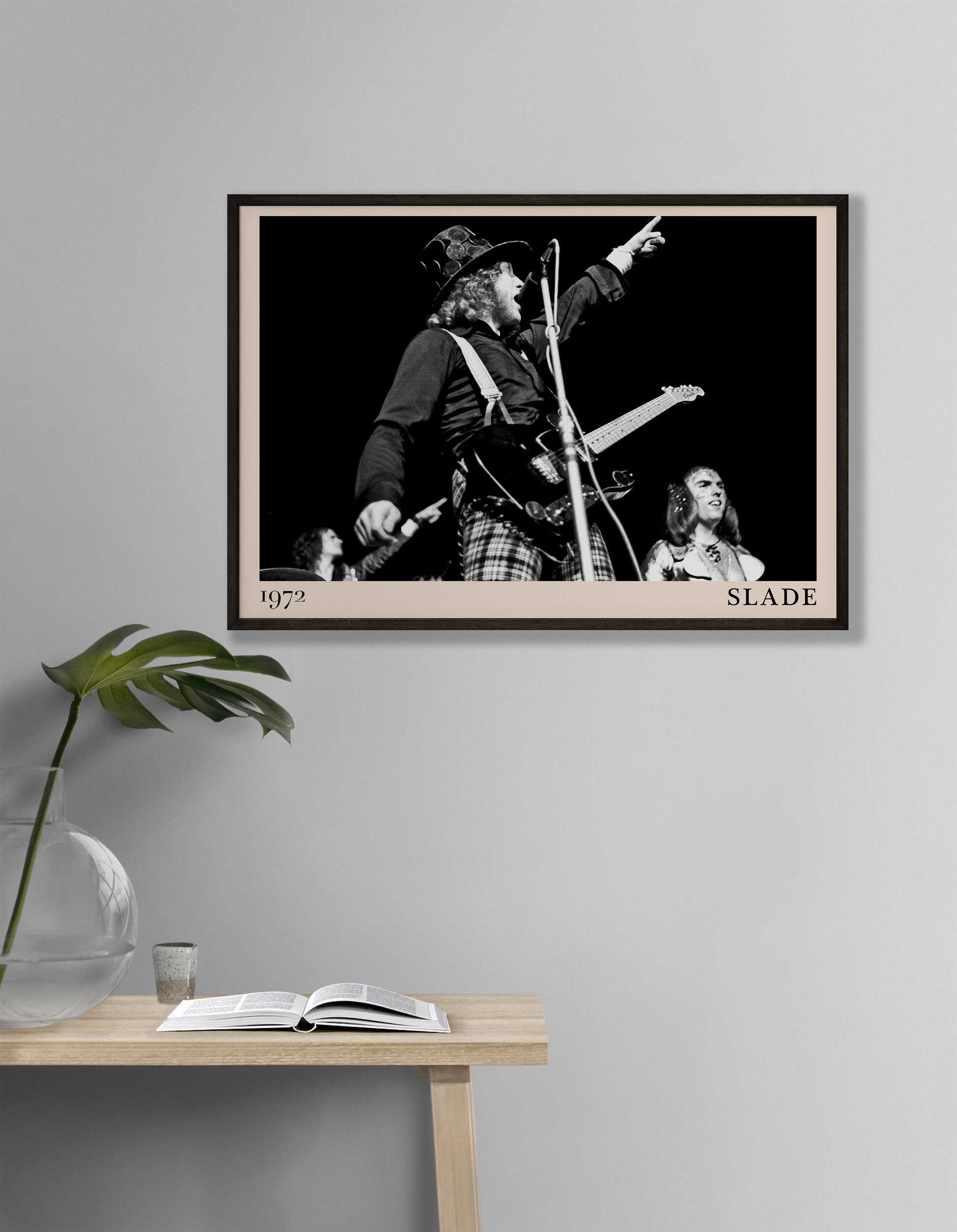 Iconic image of rock band Slade performing, captured by Heinrich Klaffs in 1971 and transformed into vintage-inspired wall decor hanging on a white living room wall