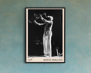 1978 photograph of Sonny Rollins playing the saxophone, transformed into a stylish black-framed jazz poster hanging on a light blue wall