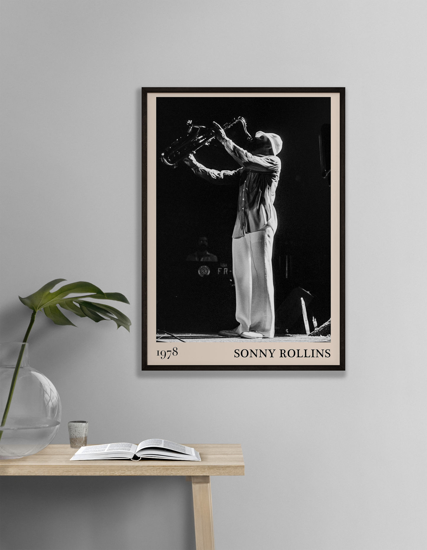1978 photograph of Sonny Rollins playing the saxophone, transformed into a cool black-framed jazz poster hanging on a grey living room wall