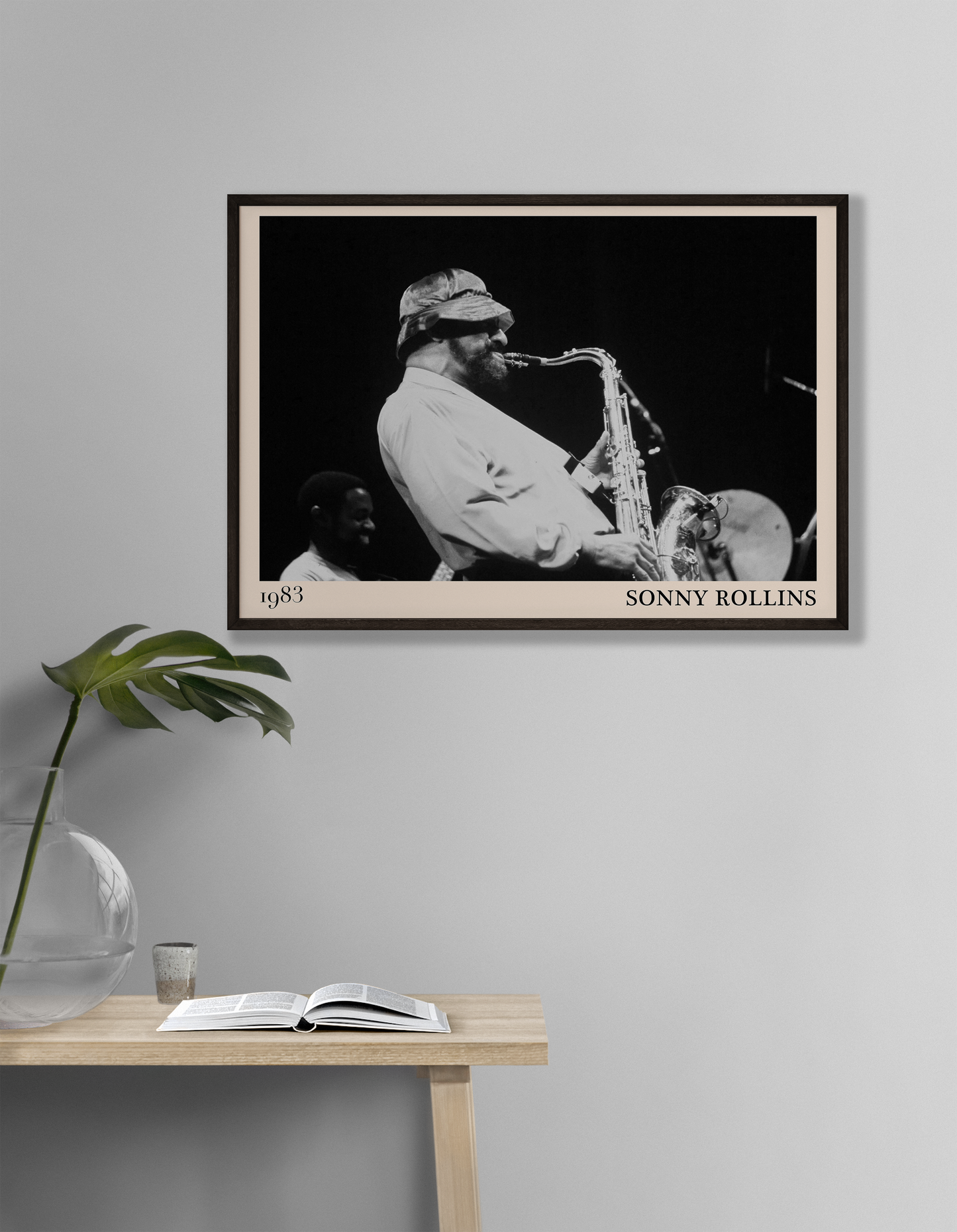 1989 photograph of Sonny Rollins playing the saxophone, transformed into a stylish black-framed jazz poster hanging on a white living room wall