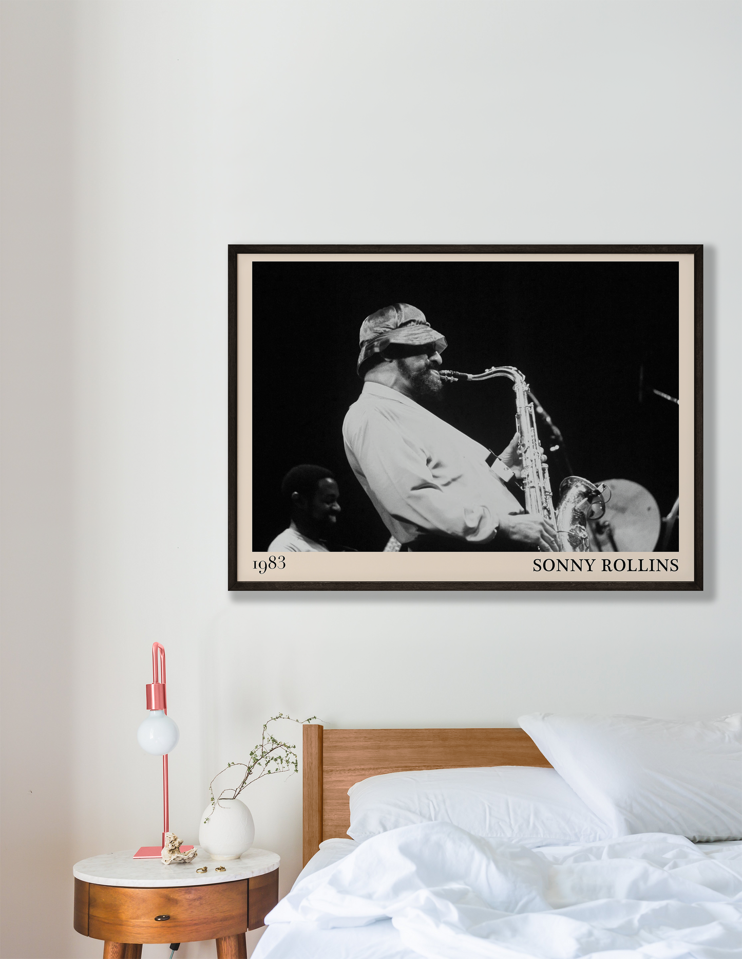 1989 photograph of Sonny Rollins playing the saxophone, transformed into a stylish black-framed jazz poster hanging on a white bedroom wall