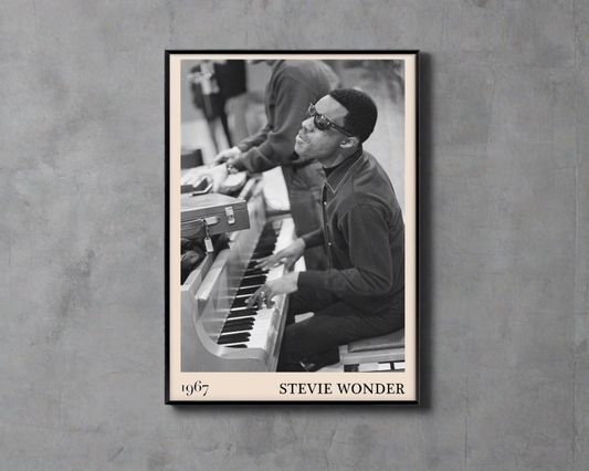 1967 photo of Stevie Wonder, crafted into an elegant black-framed print. Hanging on a concrete wall