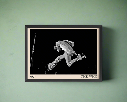 Iconic image of rock band The Who performing, captured by Heinrich Klaffs and transformed into vintage-inspired wall decor, hanging on a light green rustic concrete wall