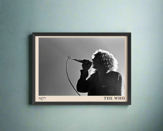 Iconic image of rock band The Who performing, captured by Heinrich Klaffs and transformed into vintage-inspired wall decor, hanging on a light blue rustic concrete wall