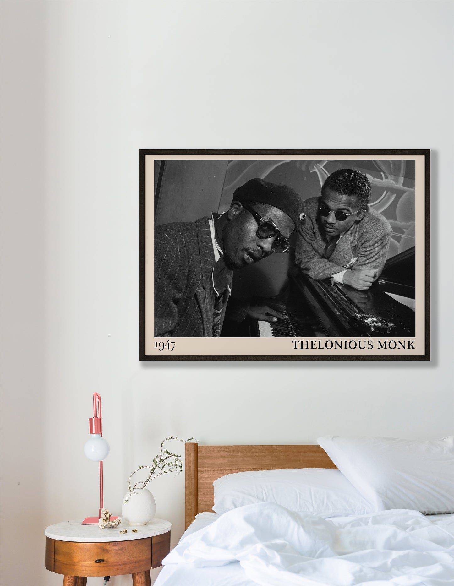 1947 photo of Thelonious Monk, crafted into an elegant black-framed print. Hanging on a white bedroom wall