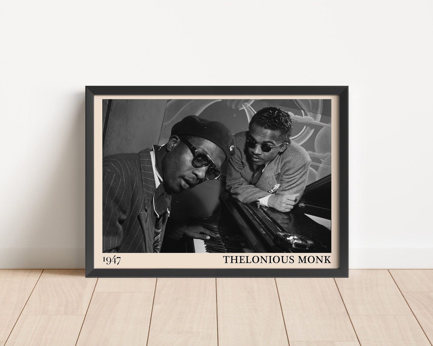 1947 photo of Thelonious Monk, crafted into an elegant black-framed print. Leaning against a white wall
