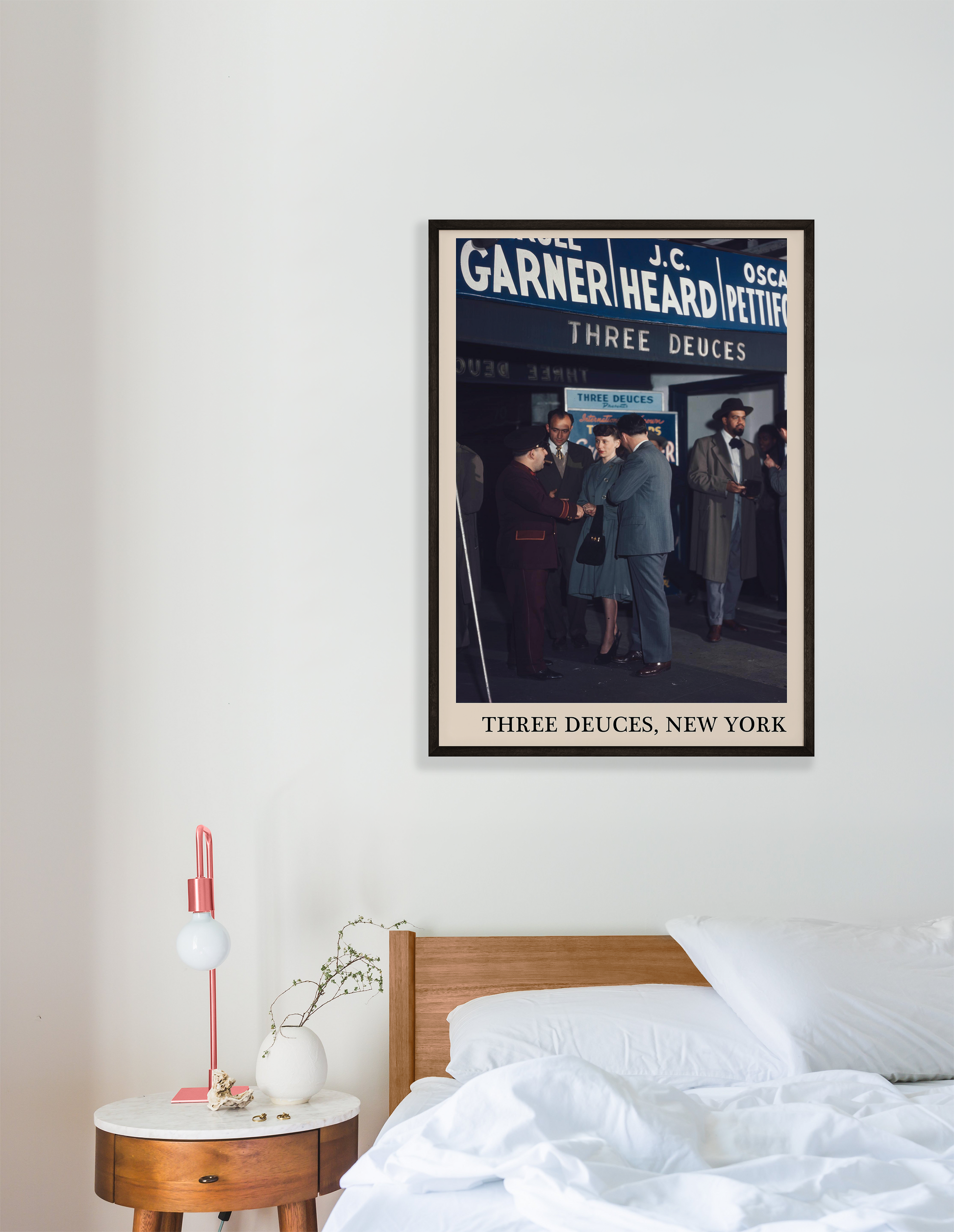 Iconic photo of the Three Deuces in New York captured in a retro black framed jazz print, hanging on a white bedroom wall