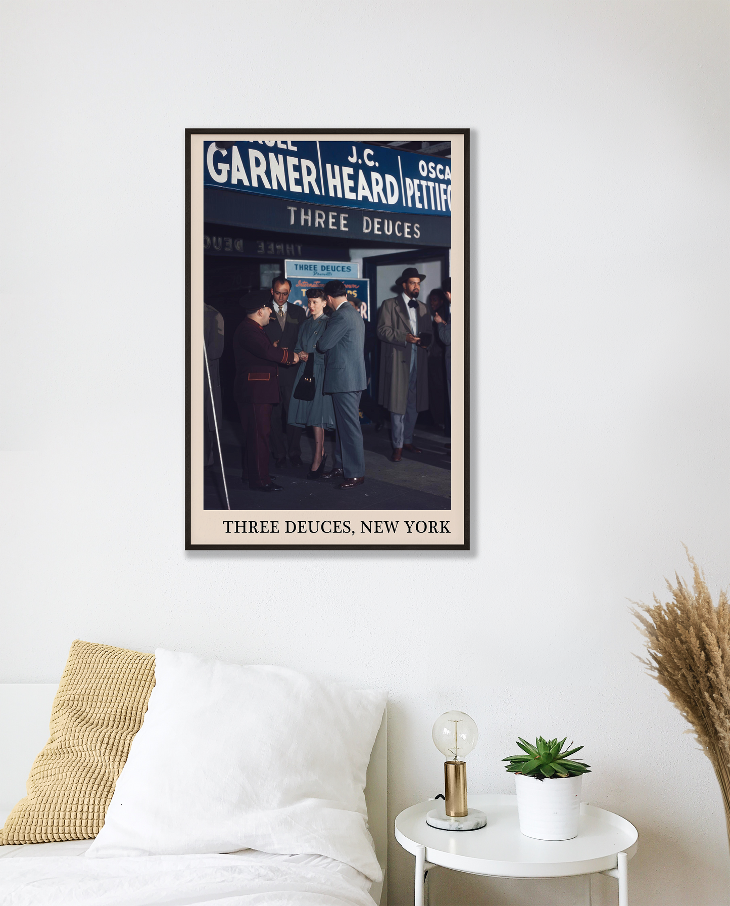 Iconic photo of the Three Deuces in New York captured in a retro black framed music print, hanging on a white bedroom wall