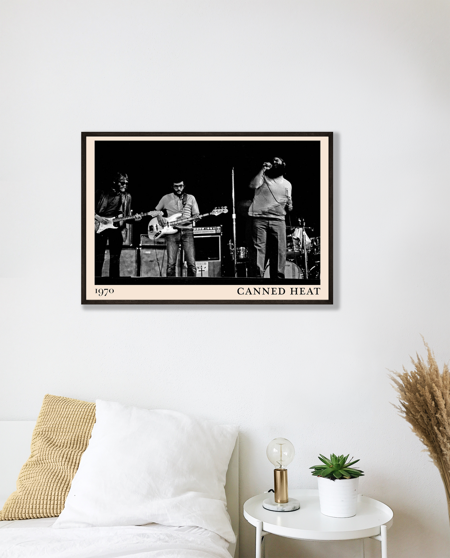 Canned Heat poster mockup in a modern bedroom, featuring a black and white band photo with 1970 date and bold border.