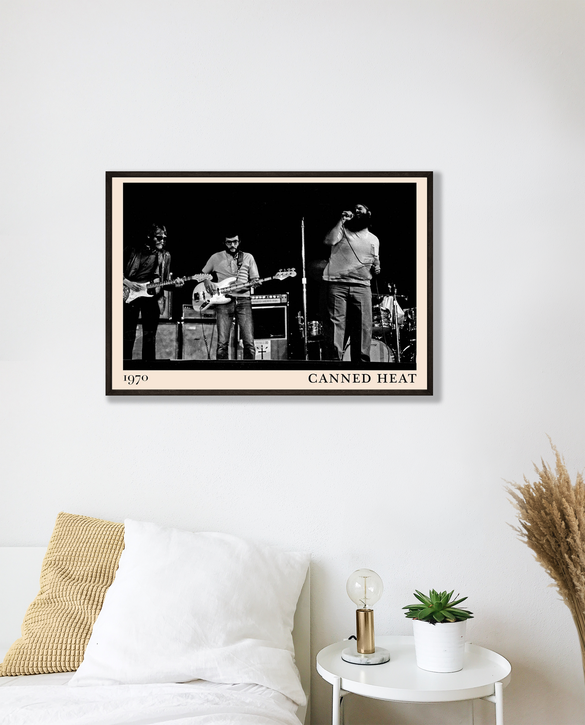Canned Heat poster mockup in a modern bedroom, featuring a black and white band photo with 1970 date and bold border.