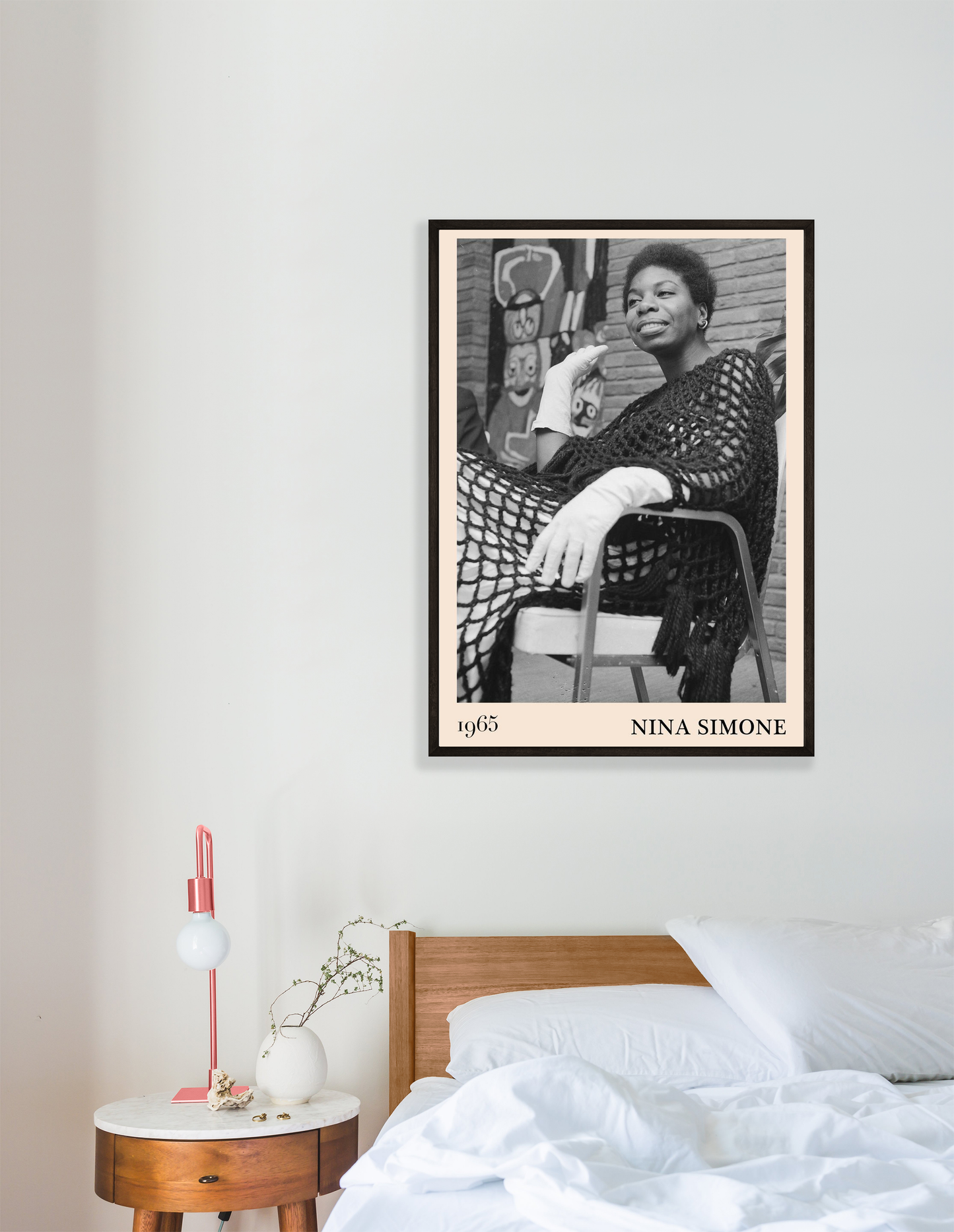 Nina Simone Jazz Print in portrait mockup above modern bed, featuring black and white 1965 photo in minimalist bedroom decor.
