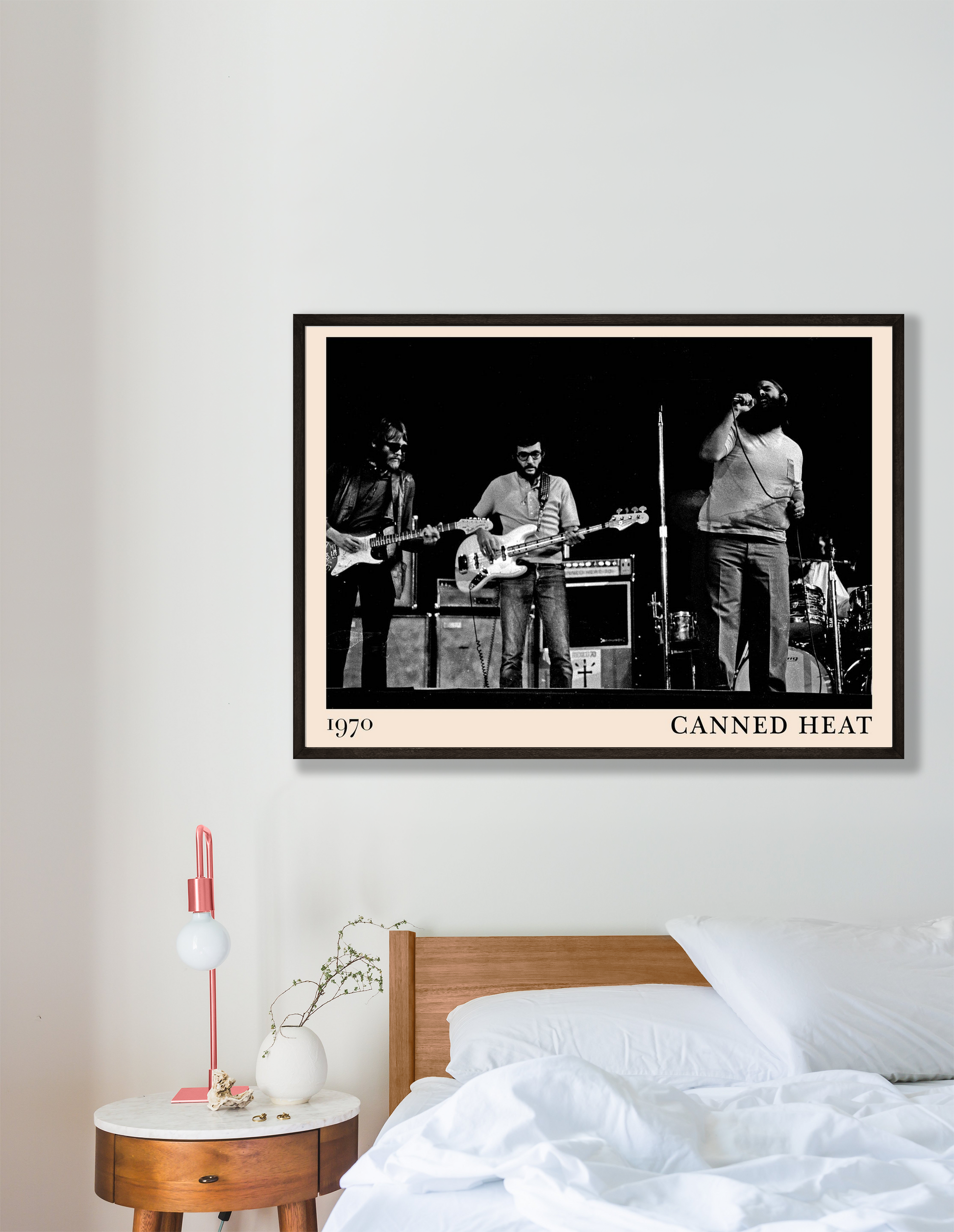 Canned Heat Poster in a modern bedroom mockup, vintage black-and-white band photo framed above a wooden bed.