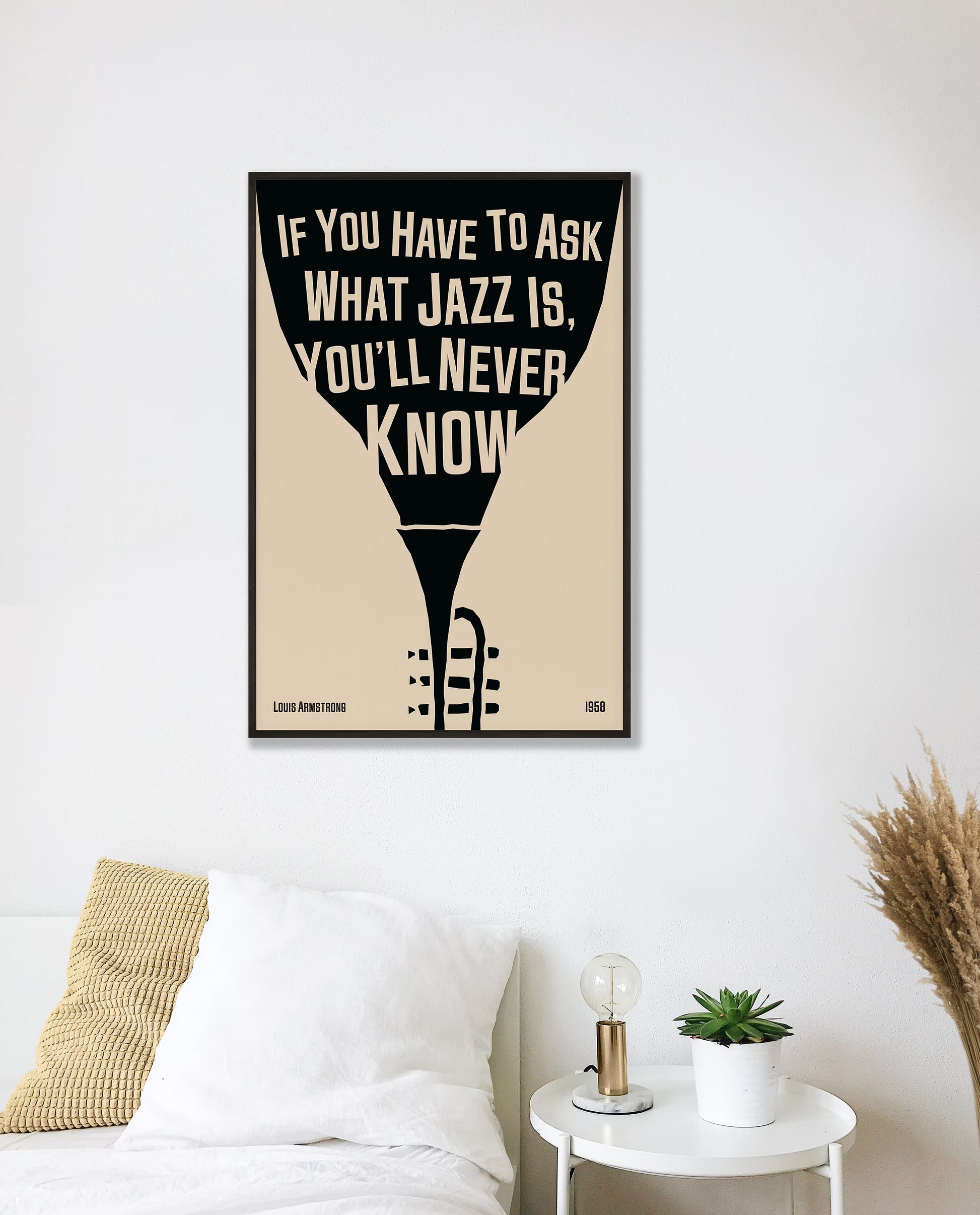Cool jazz music poster with trumpet design, featuring a Louis Armstrong quote. Retro black frame print, leaning against a white wall, perfect home decor.