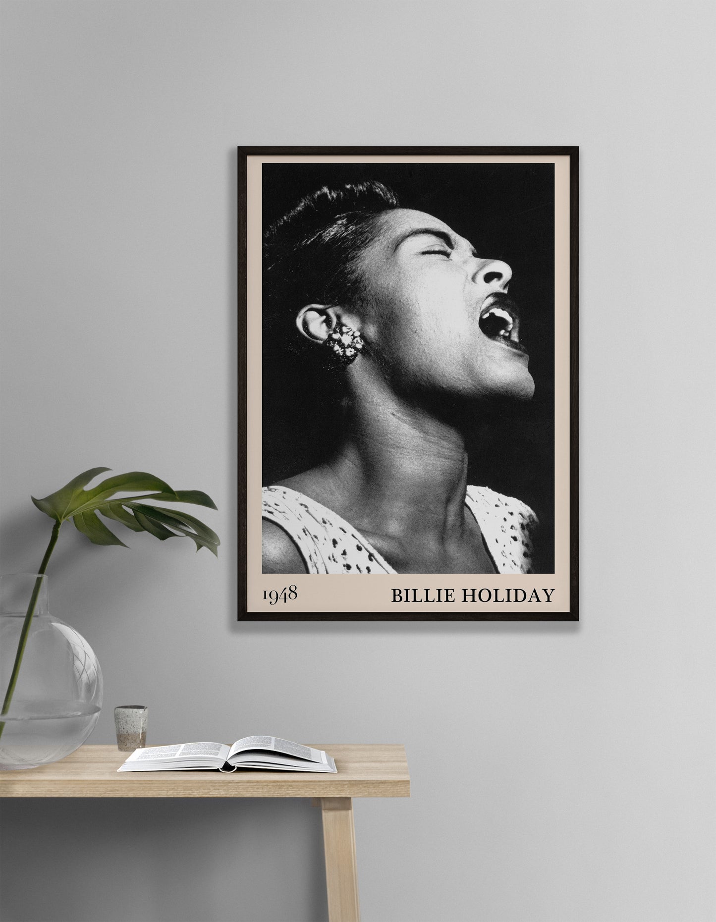 1948 photo of Billie Holiday crafted into an elegant black-framed print, hanging on a white living room wall