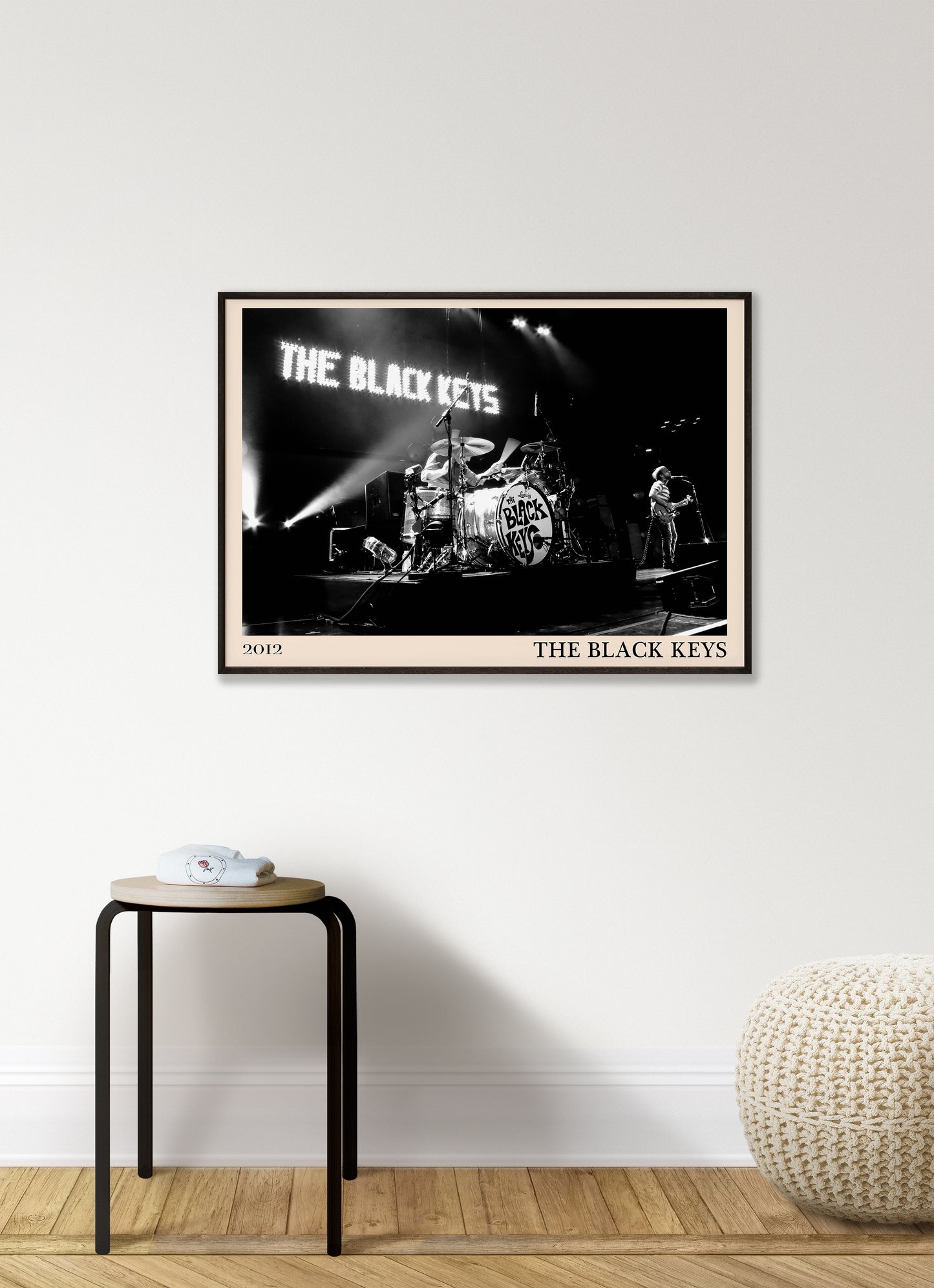 Black Keys photo from 2012 mocked up into a stylish looking vintage print, hanging on a white living room wall