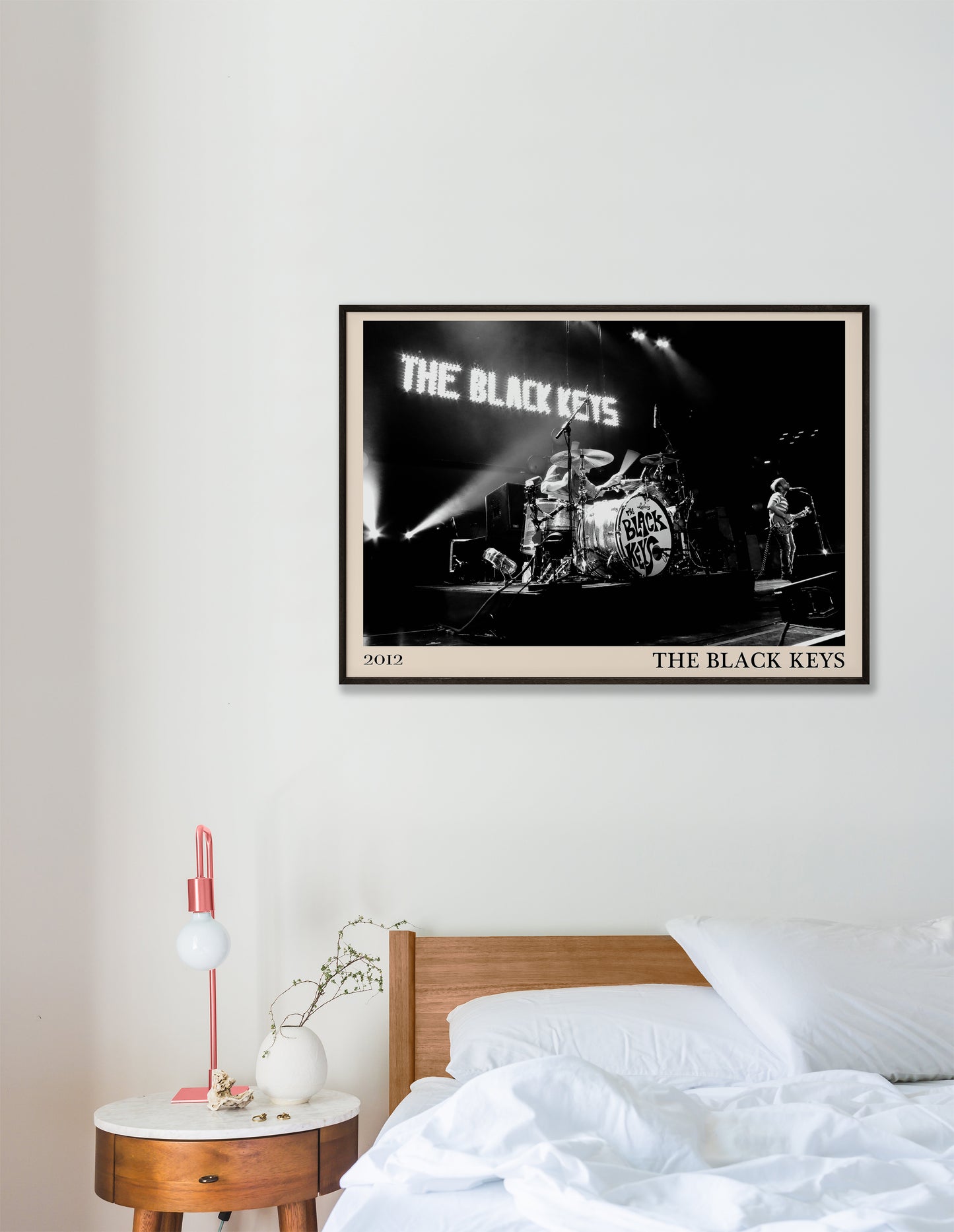 Black Keys photo from 2012 mocked up into a stylish looking vintage print, hanging on a white bedoom wall