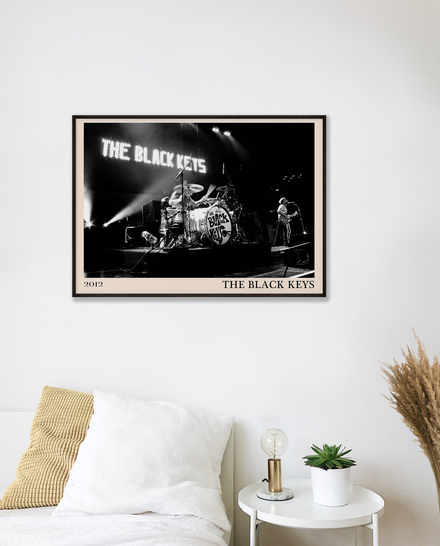Black Keys photo from 2012 mocked up into a stylish looking vintage print, hanging on a white bedroom wall