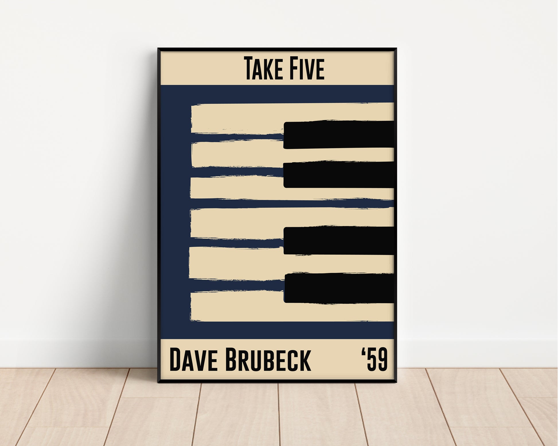 Blue and cream piano design celebrating Dave Brubeck's Take Five, released in 1959. Mocked up into black framed print leaning against a white wall