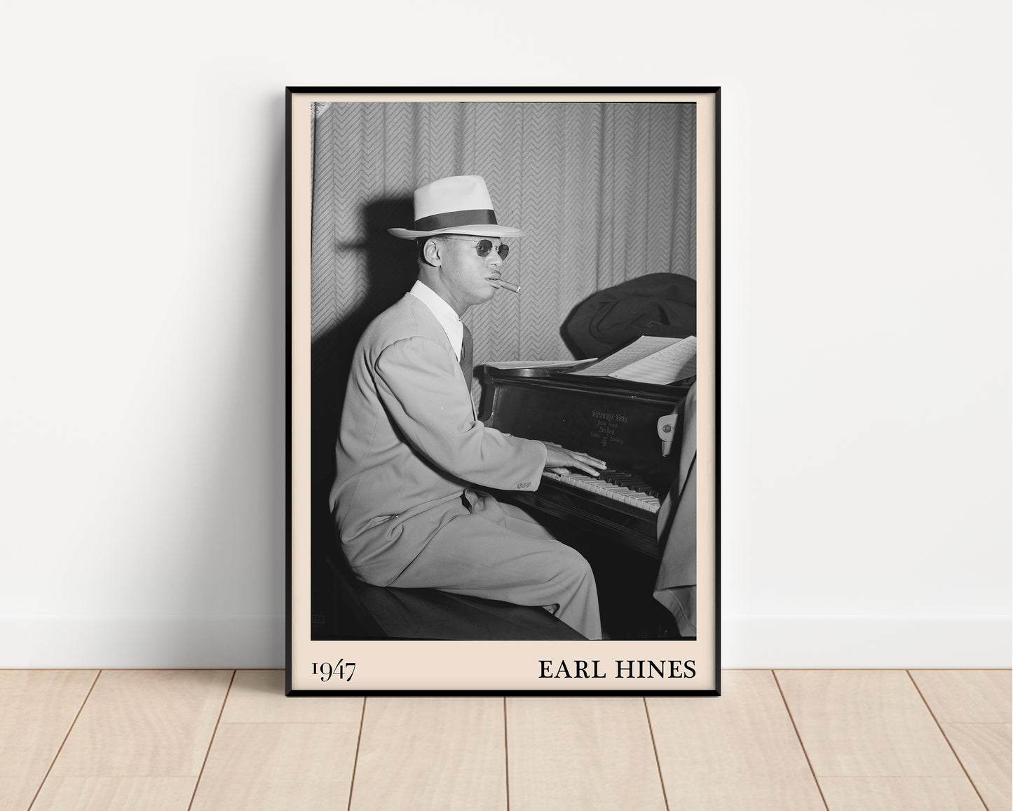 1947 photo of Earl Hines crafted into an elegant black-framed print. Leaning against a white wall