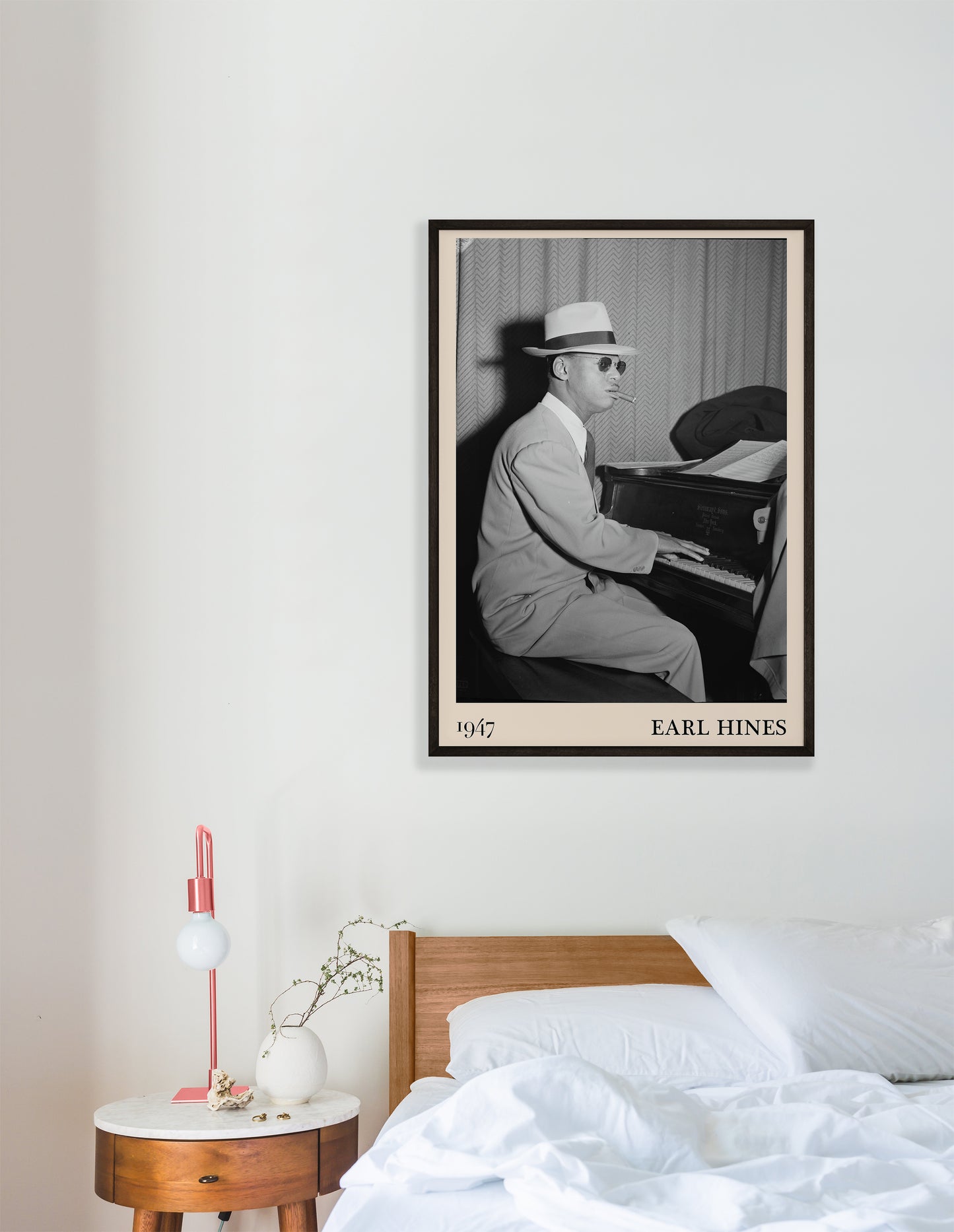 1947 photo of Earl Hines crafted into an elegant black-framed print. Hanging on a white bedroom wall