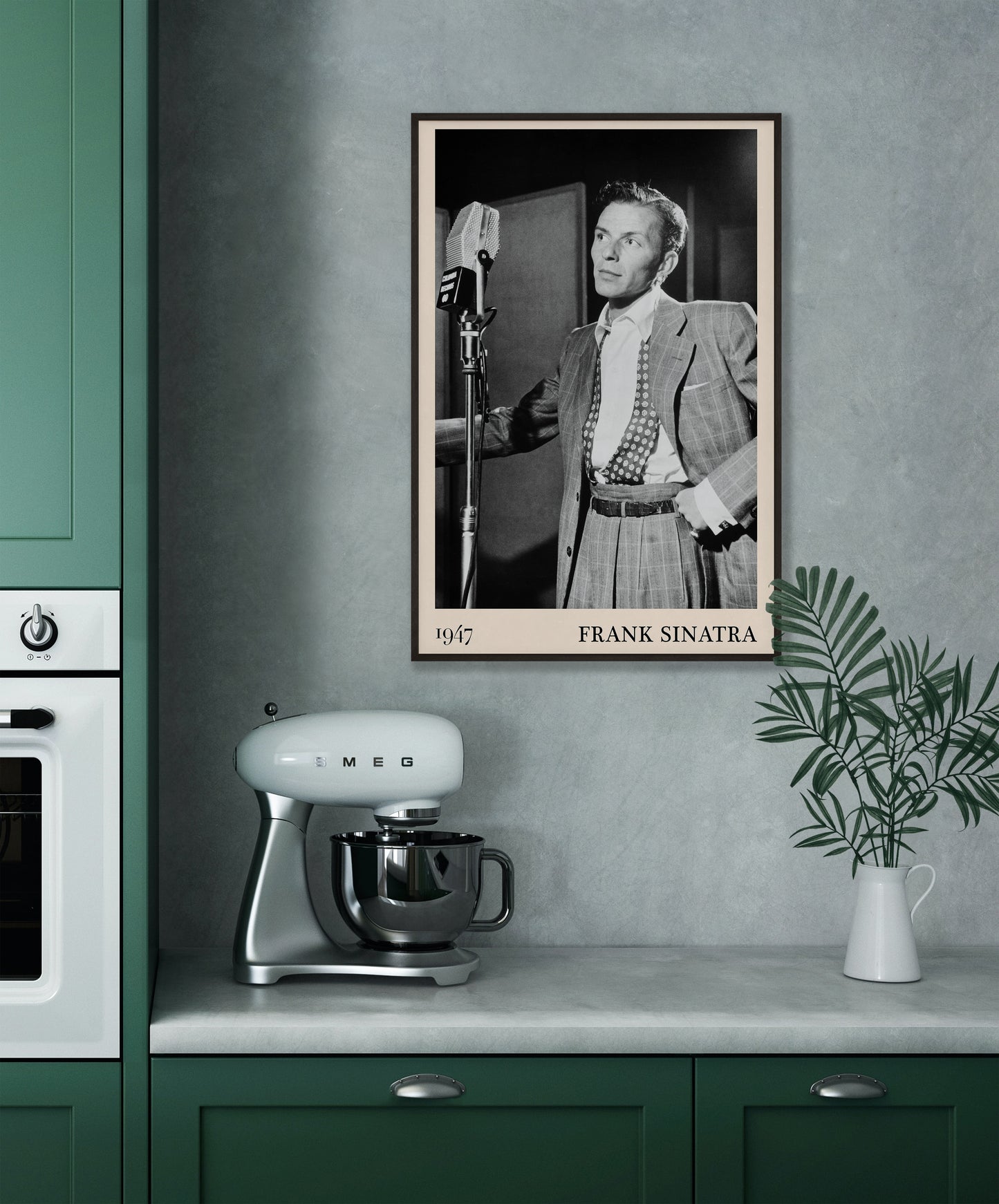 1947 photo of Frank Sinatra crafted into a black framed-poster, hanging on a grey kitchen wall