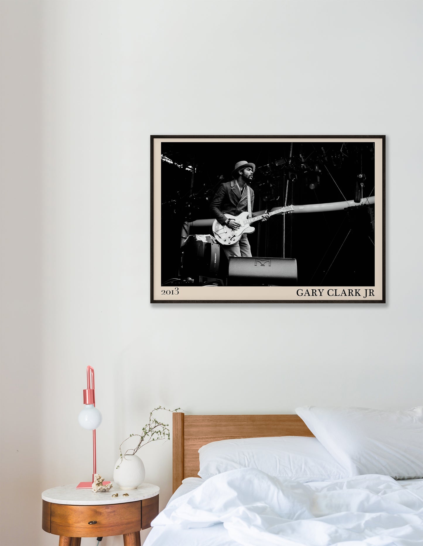2013 photo of Gary Clark Jr crafted into an elegant black-framed print. Hanging on a white bedroom wall