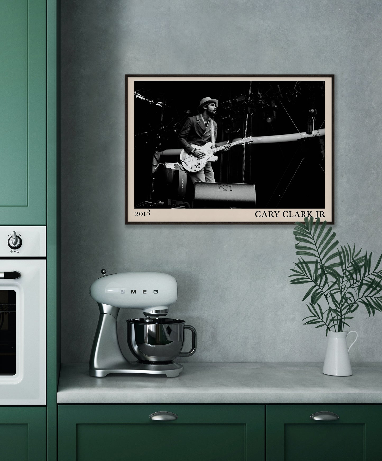 2013 photo of Gary Clark Jr crafted into an elegant black-framed print. Hanging on a grey kitchen wall