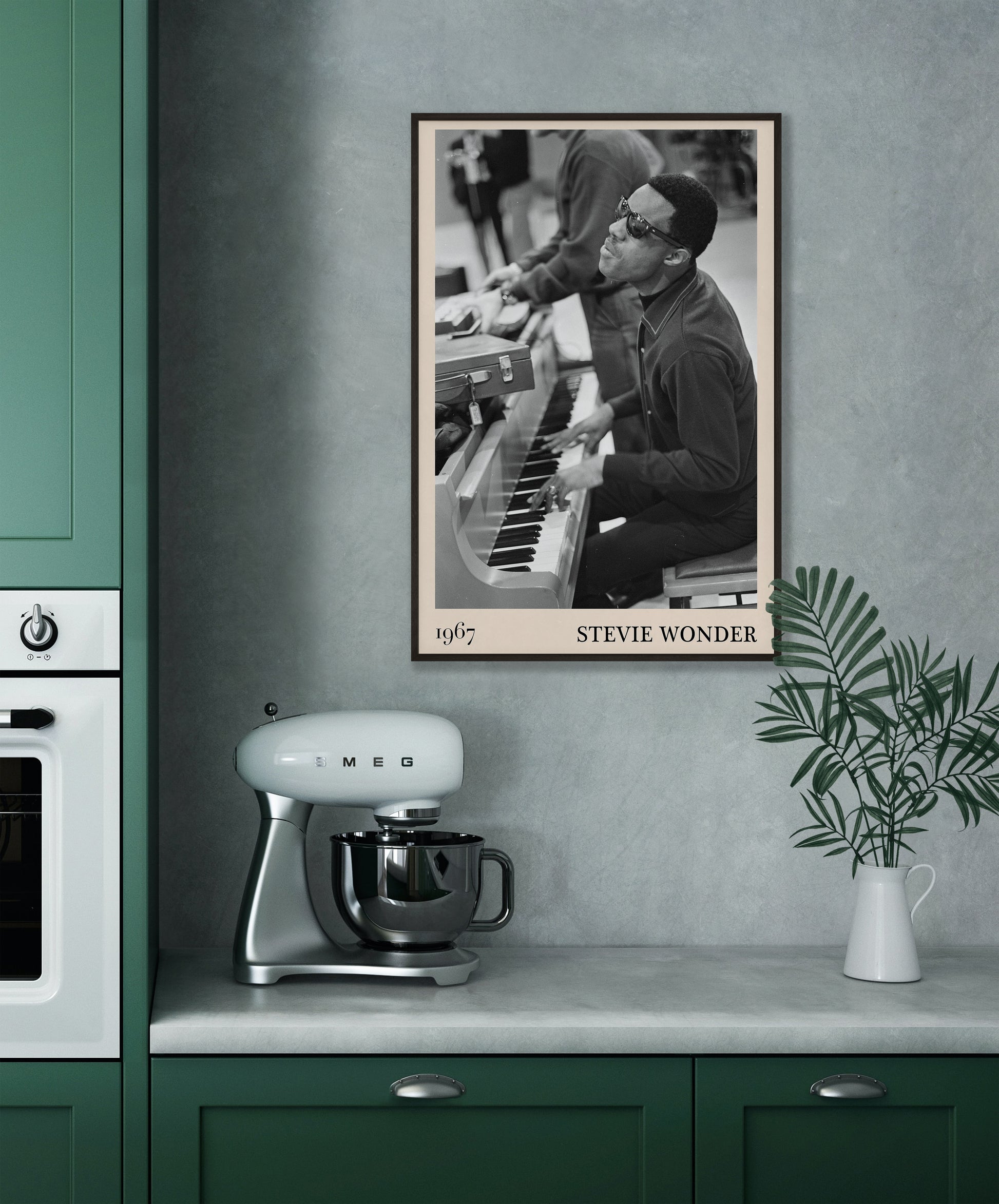 1967 photo of Stevie Wonder, crafted into an elegant black-framed print. Hanging on a grey kitchen wall