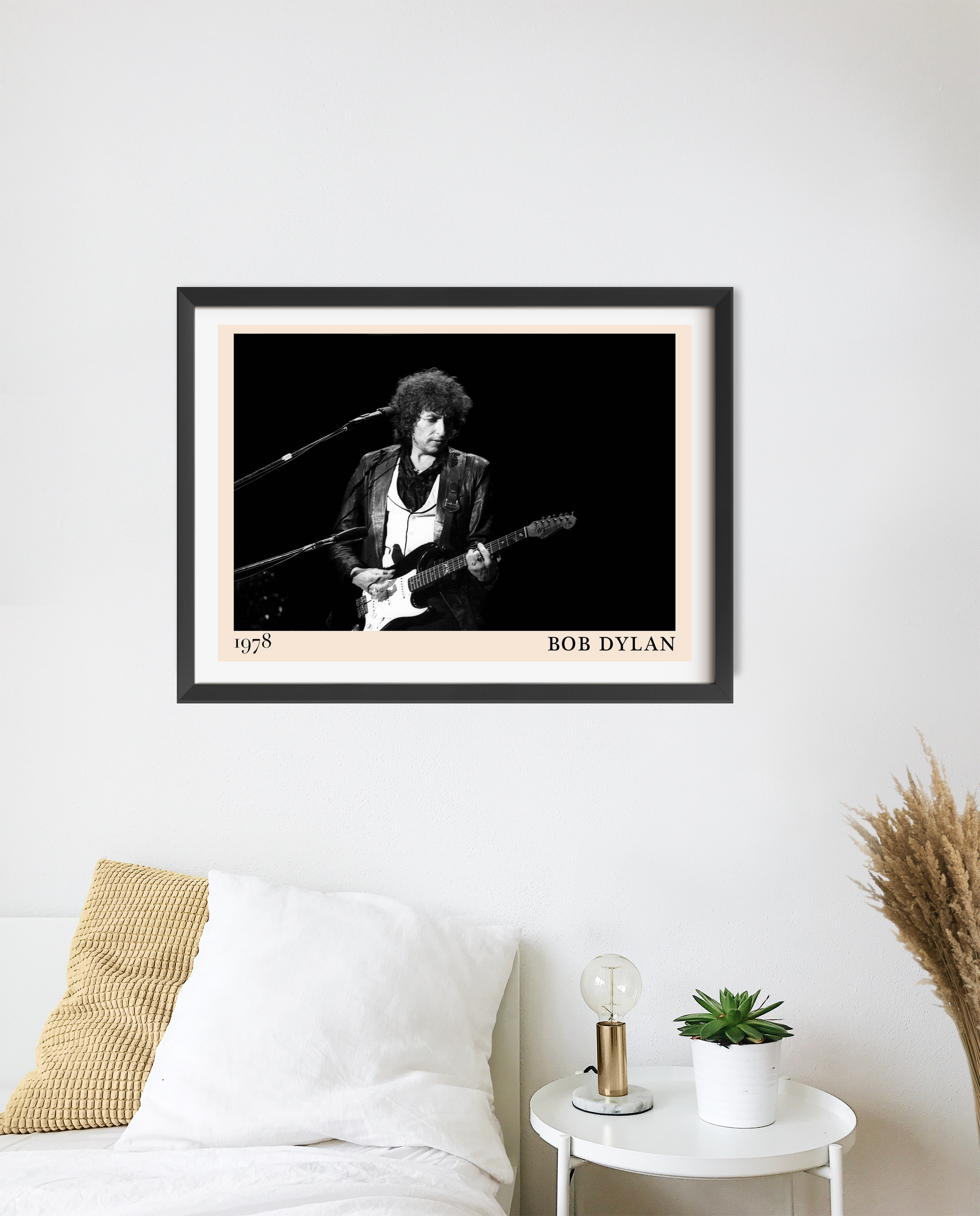 Bob Dylan Folk Concert Poster in landscape 20 mount mockup above a white bed, features black and white stage photo design.