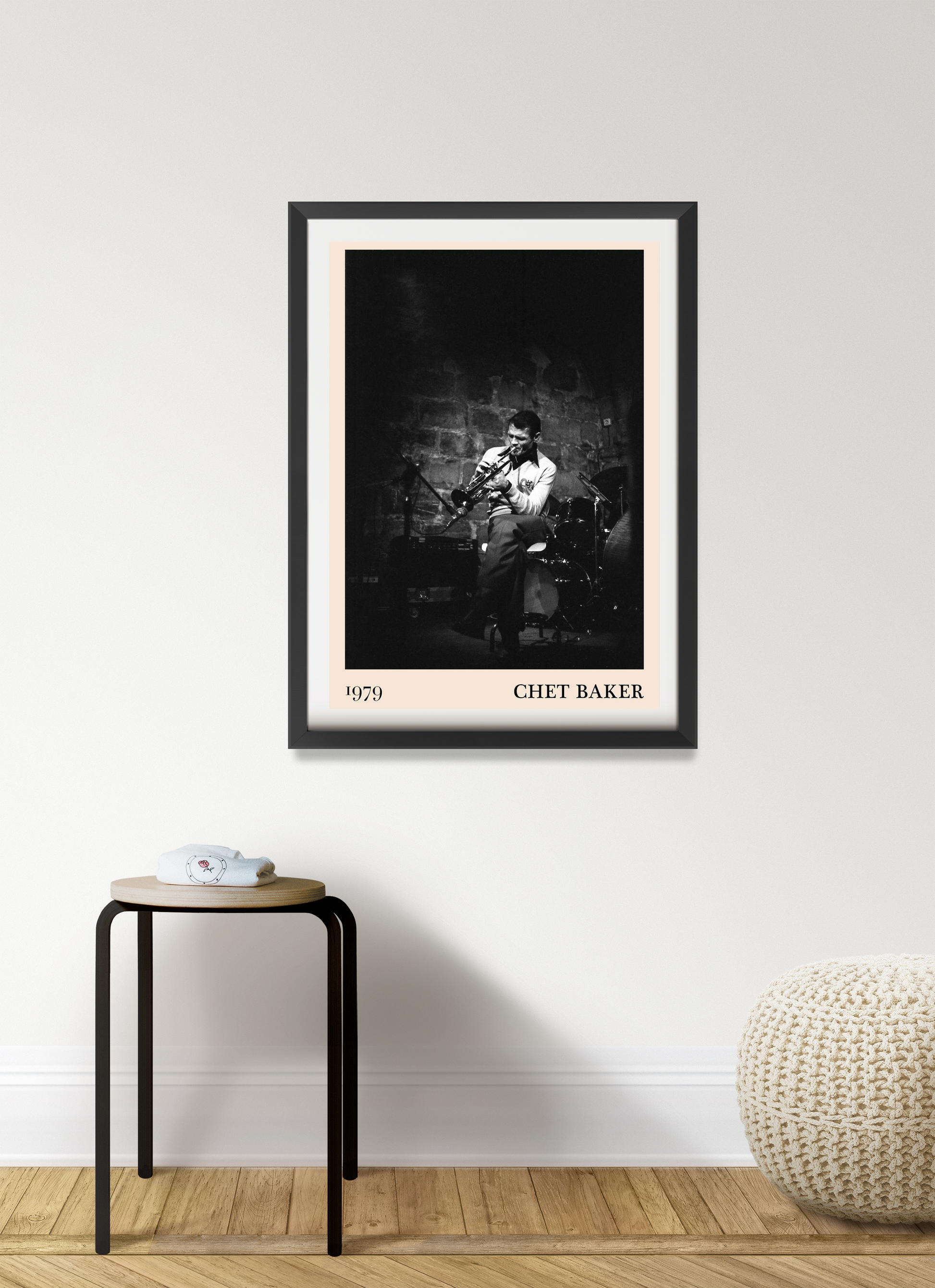 Chet Baker vintage concert poster in a black frame, portrait 7 mount, jazz musician photo on a modern living room wall.