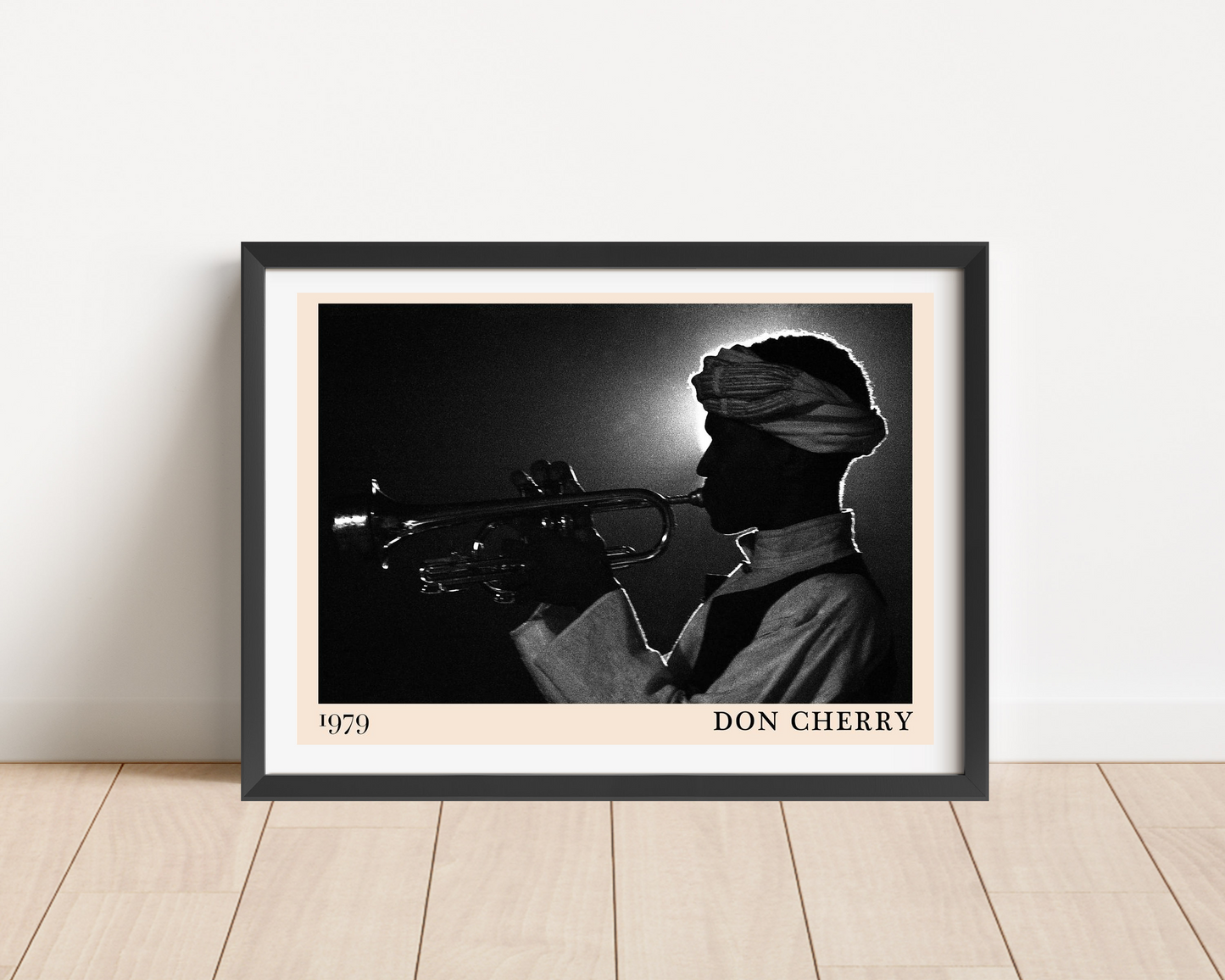 Don Cherry Jazz Poster in landscape frame mockup, black and white trumpet silhouette design on wood floor against white wall
