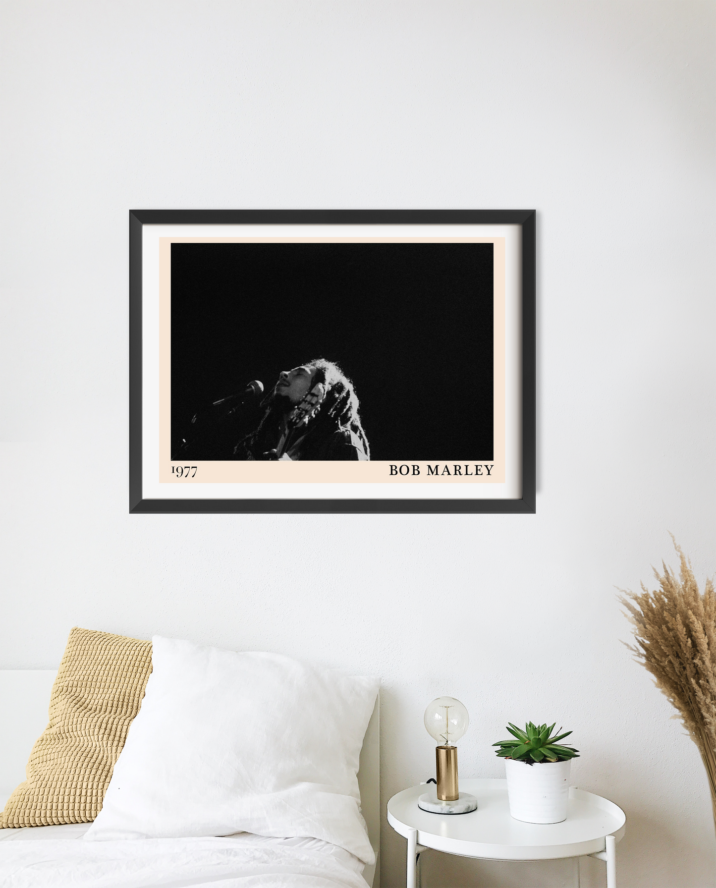 Bob Marley concert poster in a landscape 20 mount mockup, black and white design above a modern bed with cozy decor.