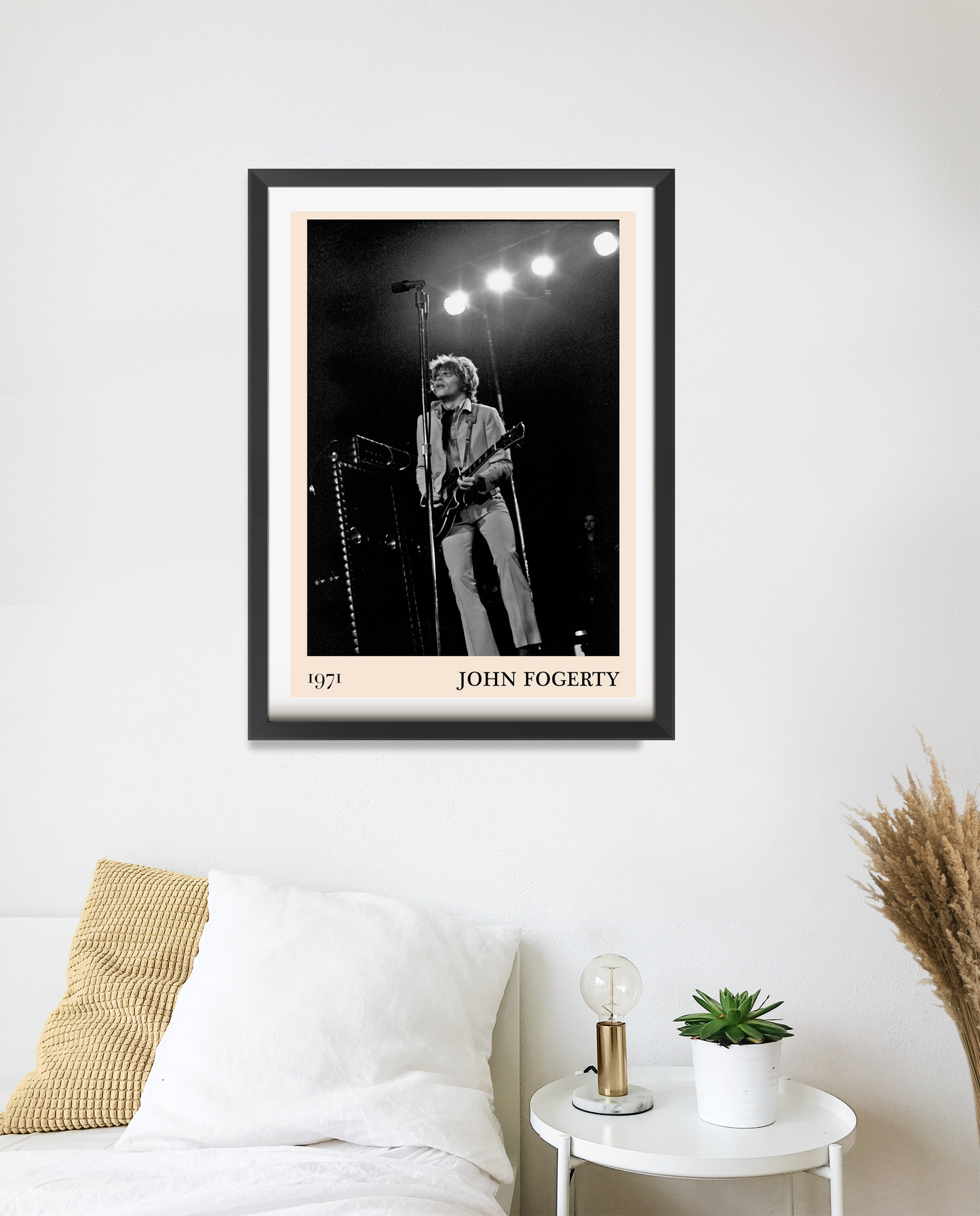 John Fogerty Retro Rock Poster in portrait 20 mount mockup above a modern bed, featuring black and white concert design.