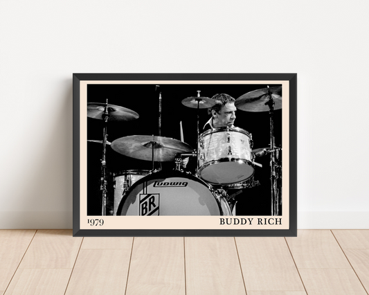 Buddy Rich Drummer Jazz Concert Print in landscape mockup, framed black and white jazz drum scene leaning on wood floor