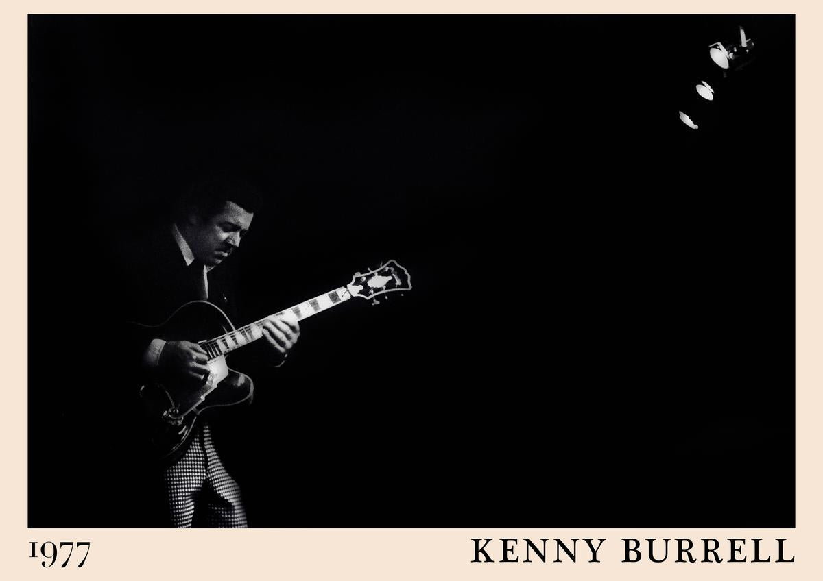 Poster featuring Kenny Burrell playing guitar on stage, black and white 1977 jazz concert scene, retro framed wall art with